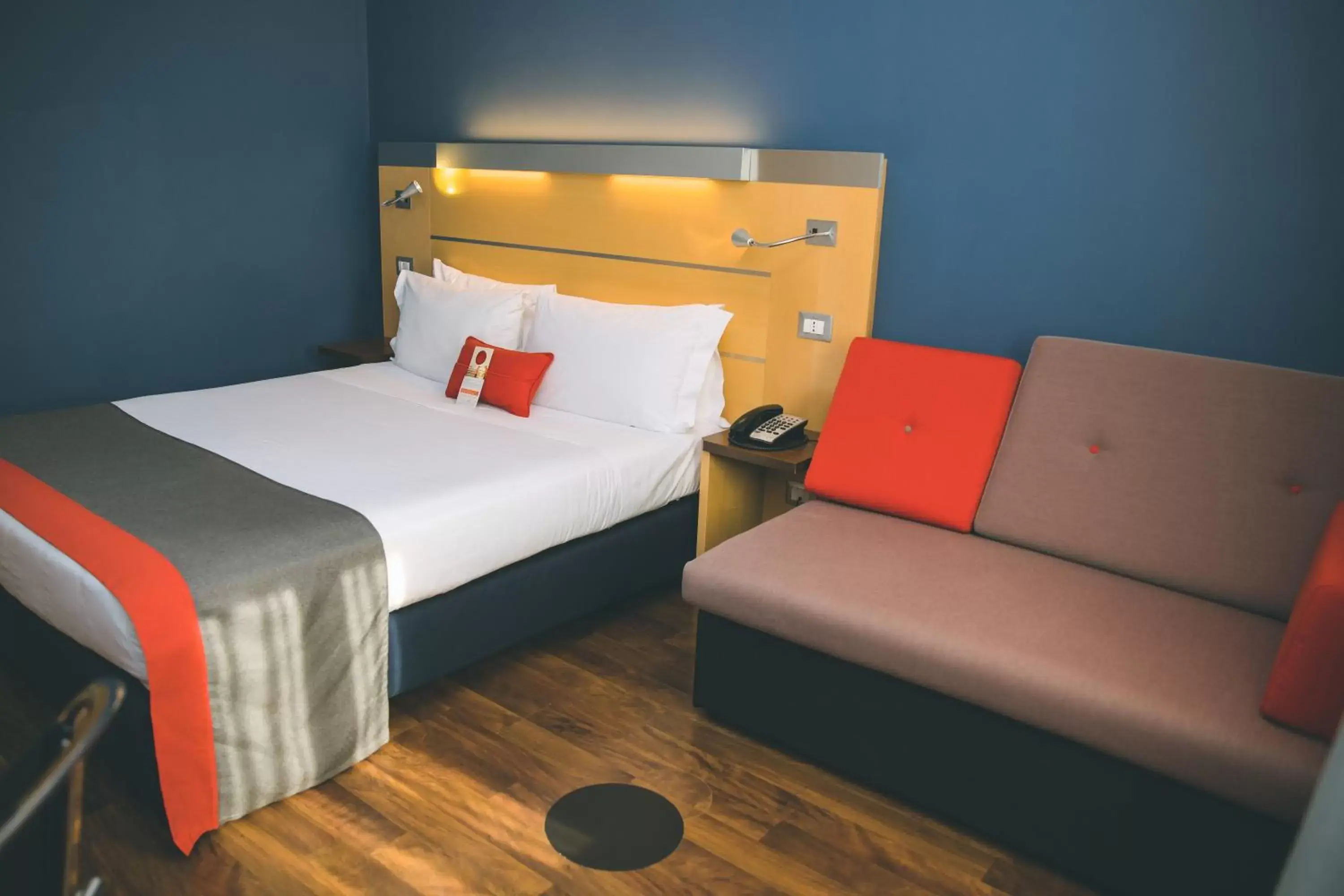 Bed in Holiday Inn Express Milan-Malpensa Airport, an IHG Hotel