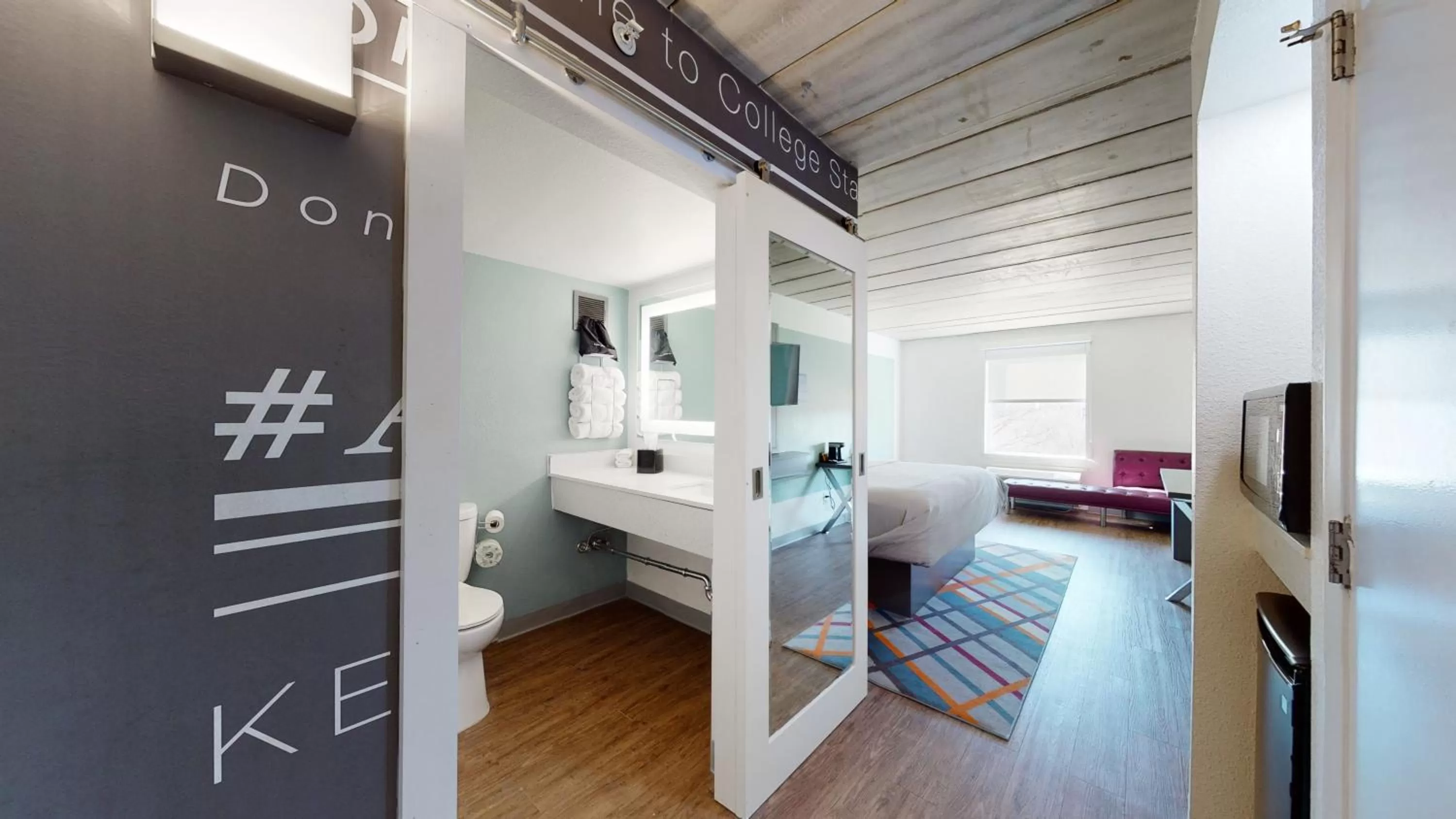 Bathroom, Bed in voco College Station Aggieland by IHG