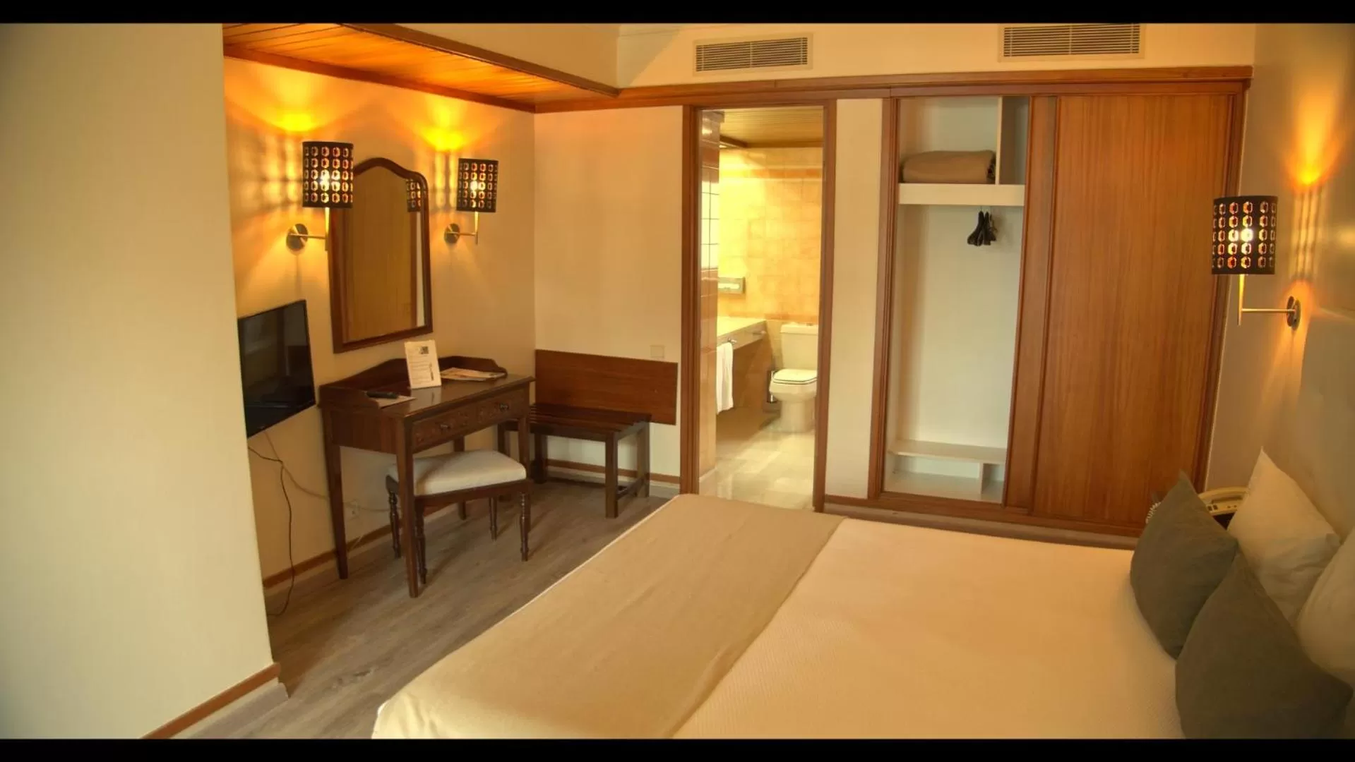 Bed in Hotel Solar Palmeiras