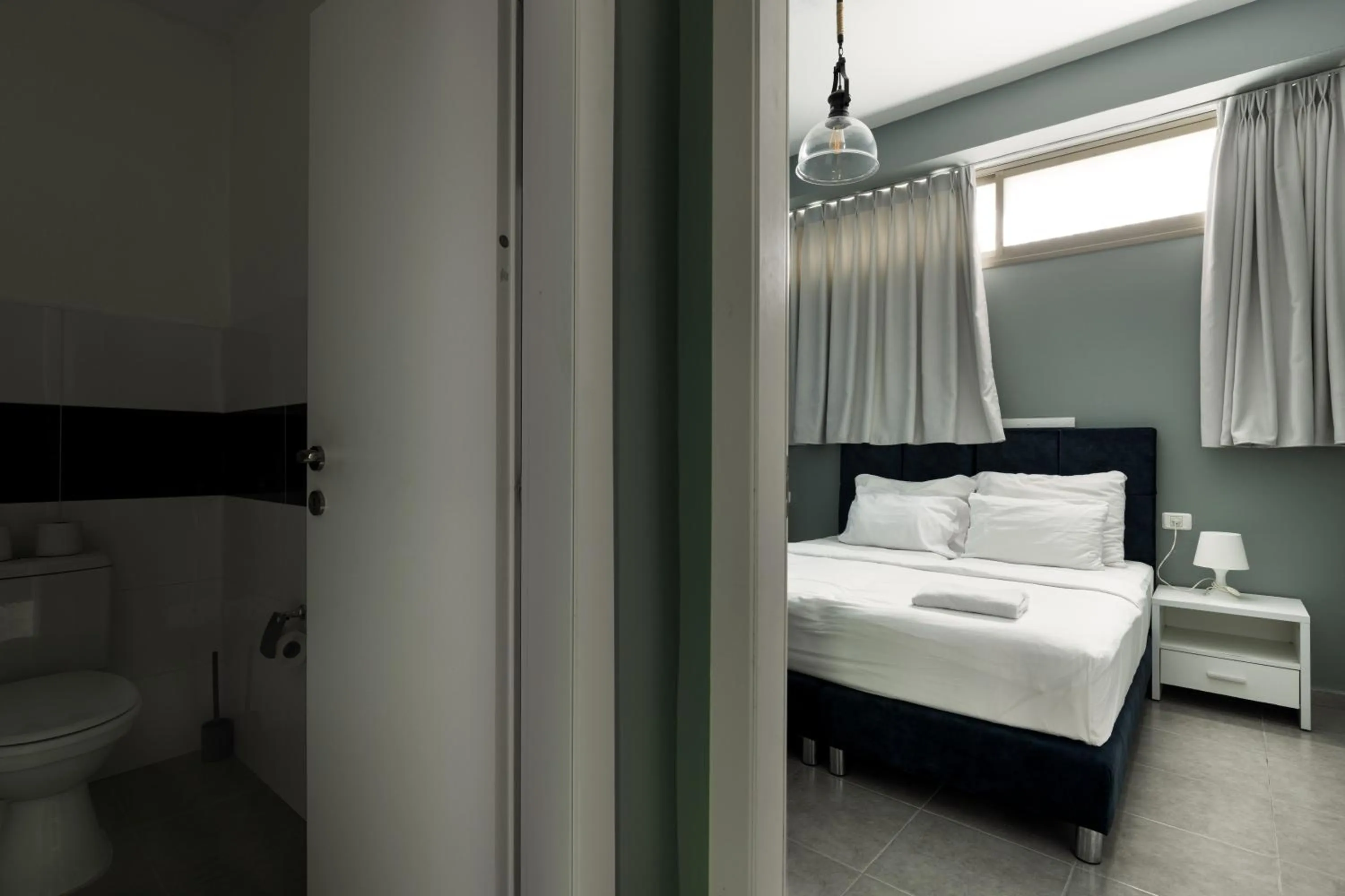 Bedroom, Bed in Liber Tel Aviv Sea Shore Suites BY RAPHAEL HOTELS