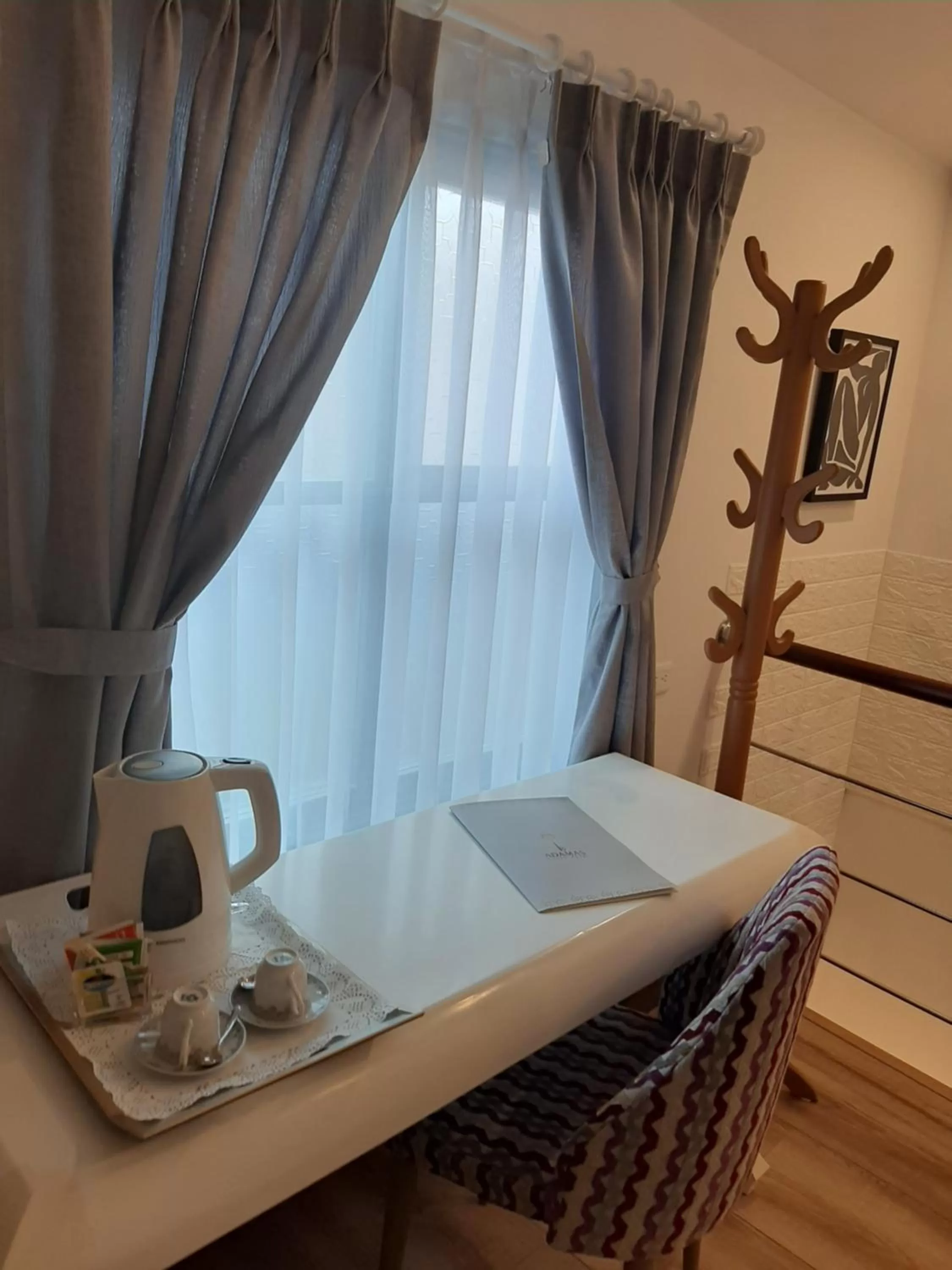 Seating area, Bed in Adamas House Hotel Boutique