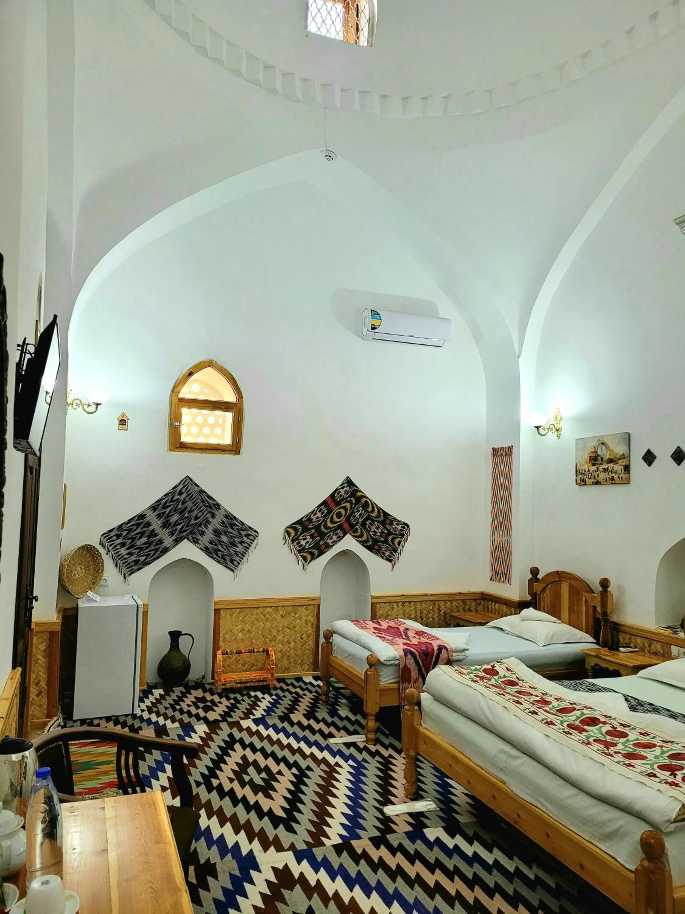 Bed in madrasah Polvon-Qori boutique hotel XIX century