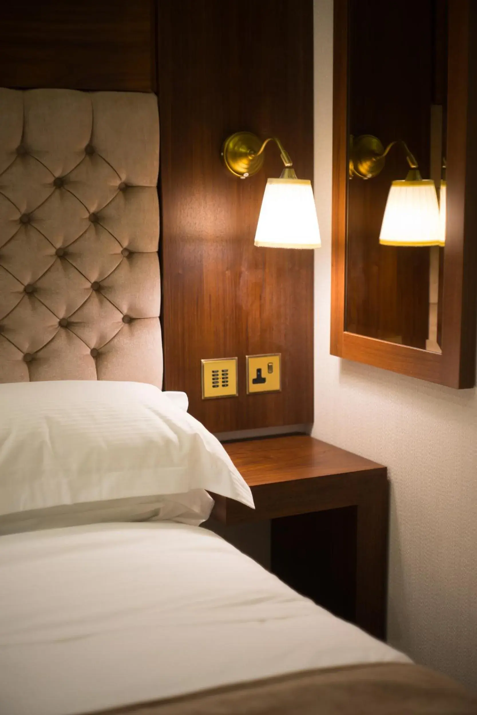 Bed in Kensington Prime Hotel