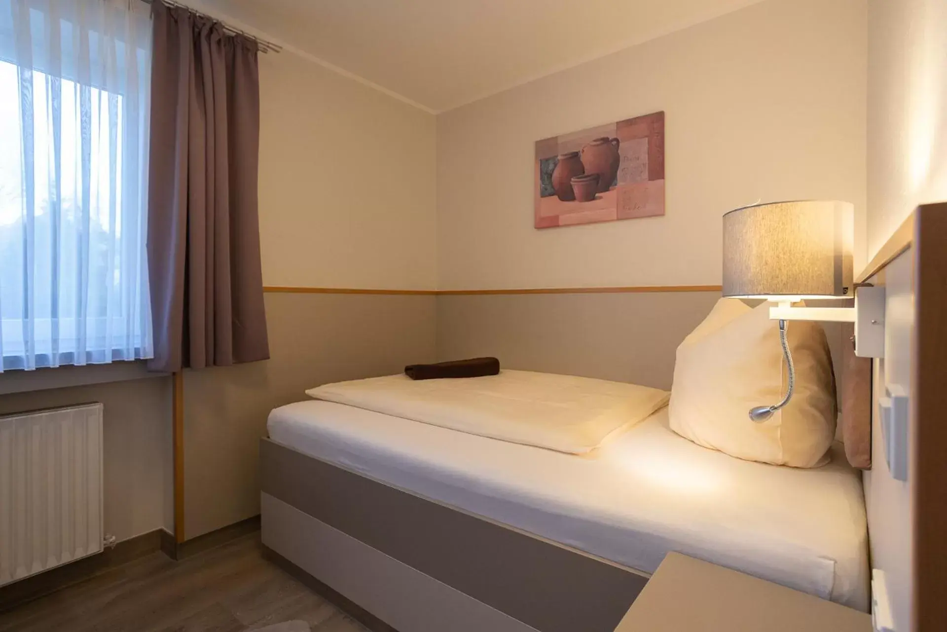 Bed in Stadt-gut-Hotel Siegboot