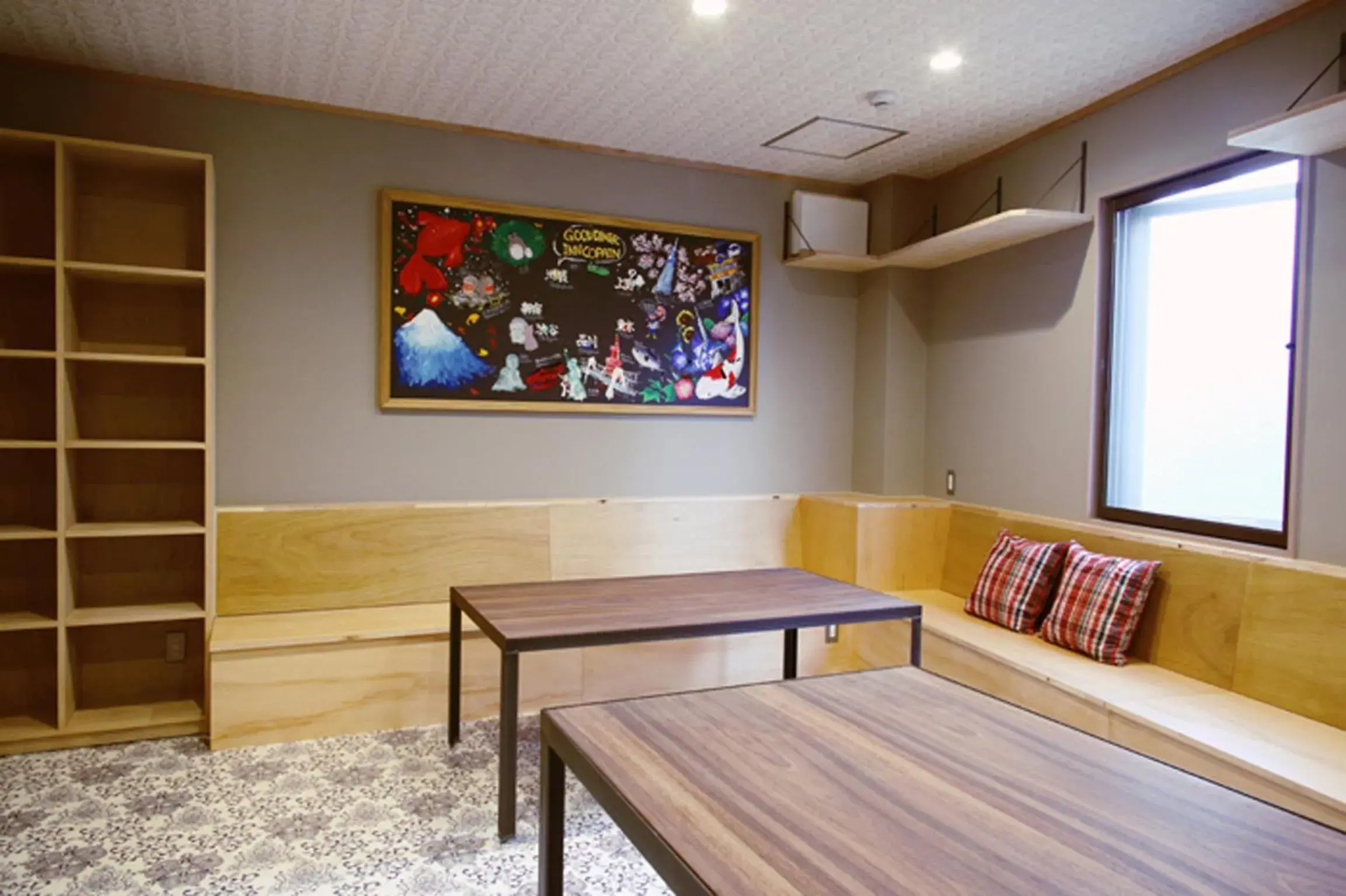 Communal lounge/ TV room, TV/Entertainment Center in Good Diner Inn Copain