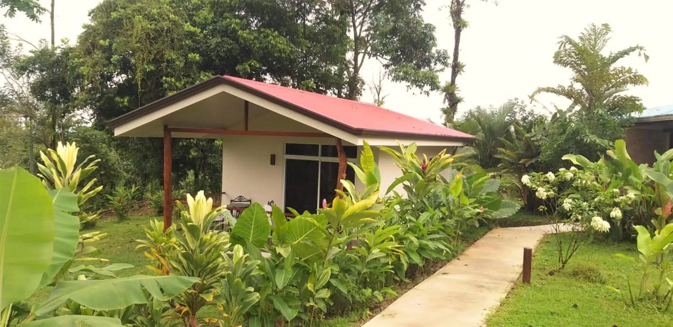 Property building in Tropical Suites & Villas