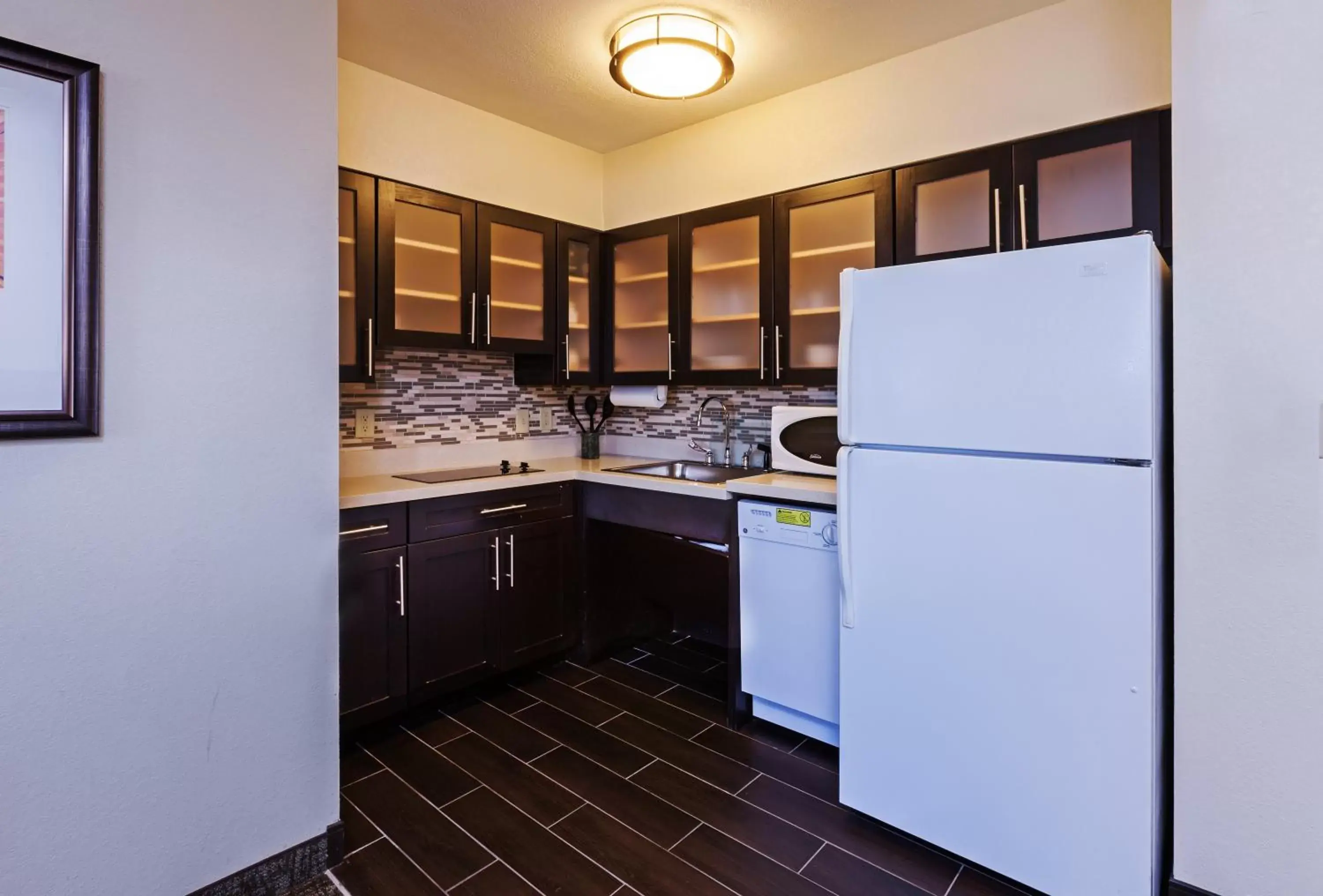 Photo of the whole room, Kitchen/Kitchenette in Staybridge Suites Tulsa-Woodland Hills, an IHG Hotel