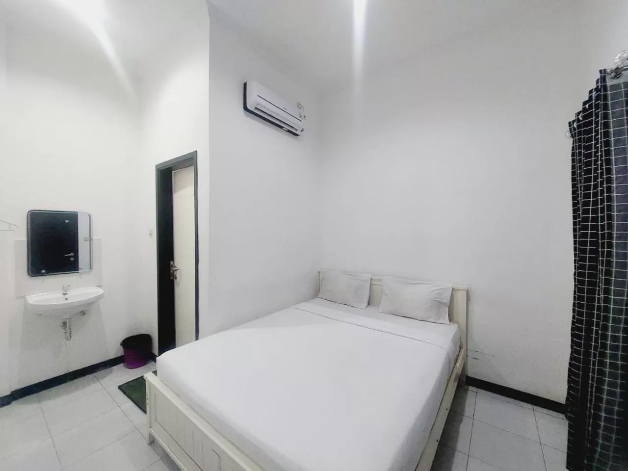 Bed in COZY STAY KUPANG