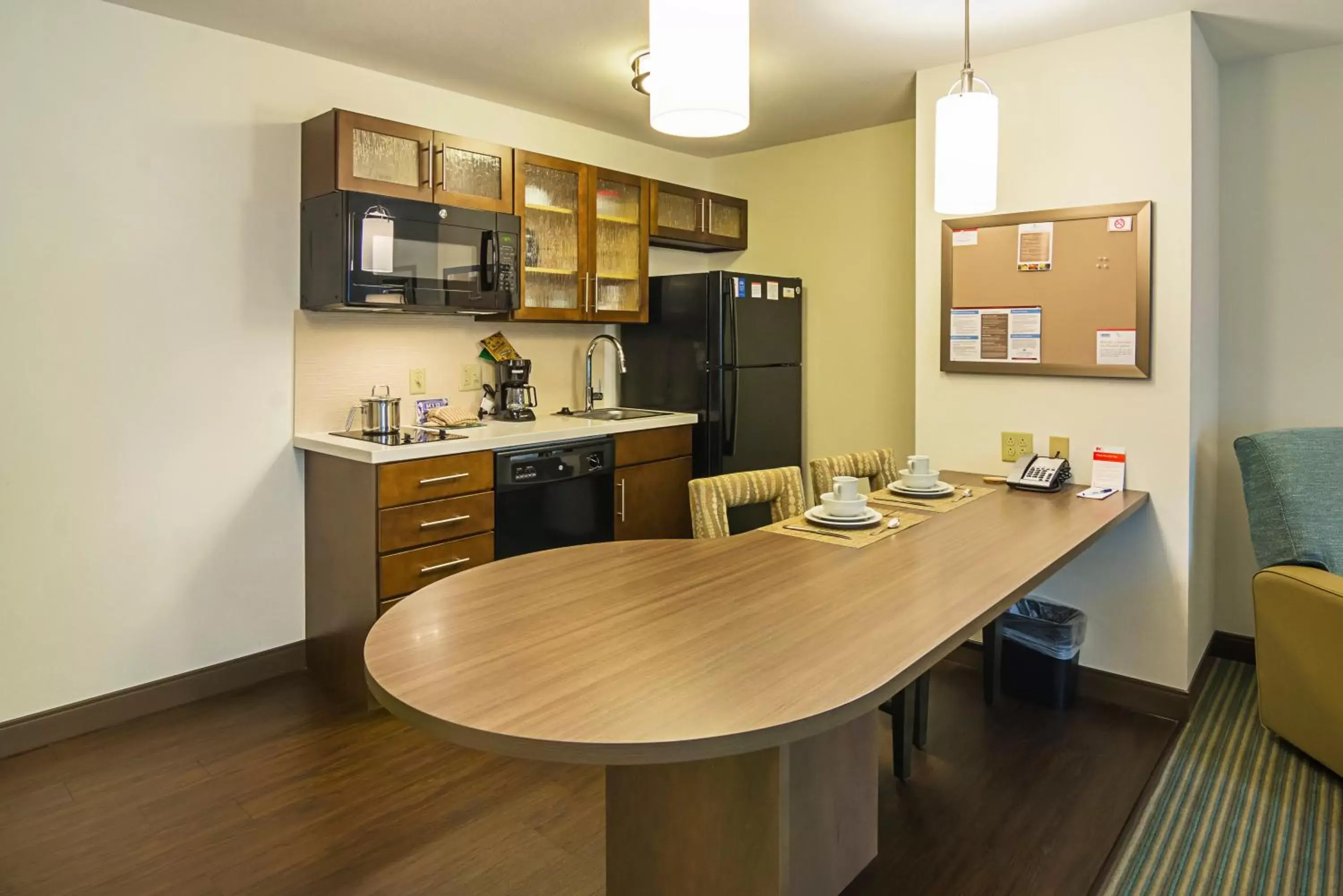 Photo of the whole room, Kitchen/Kitchenette in Candlewood Suites - Pensacola - University Area, an IHG Hotel