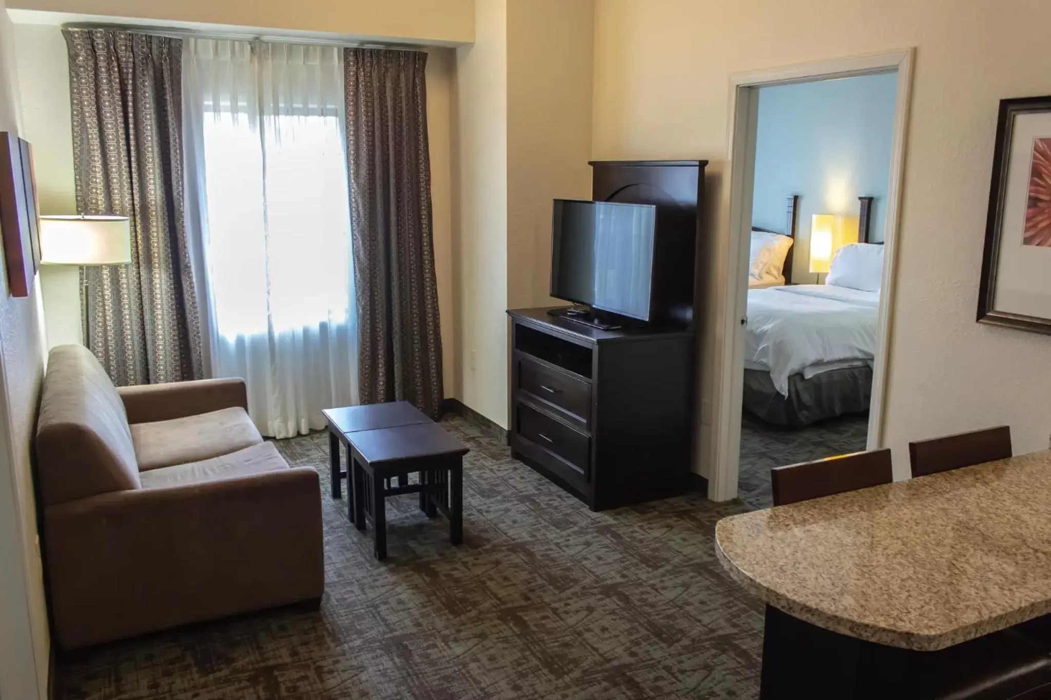 Photo of the whole room, TV/Entertainment Center in Staybridge Suites Minot, an IHG Hotel