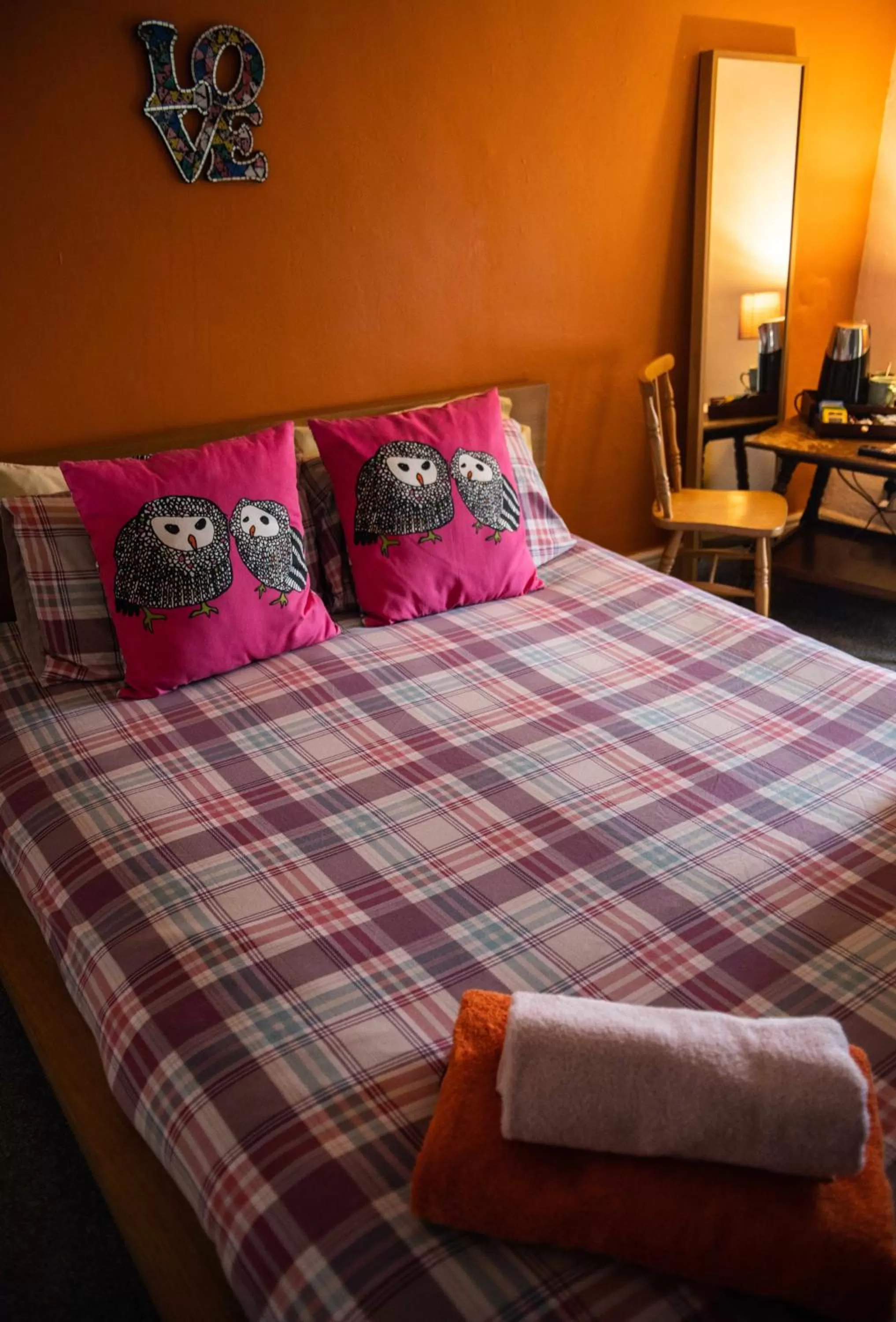 Bed in Manorbier Castle Inn Sunset Room