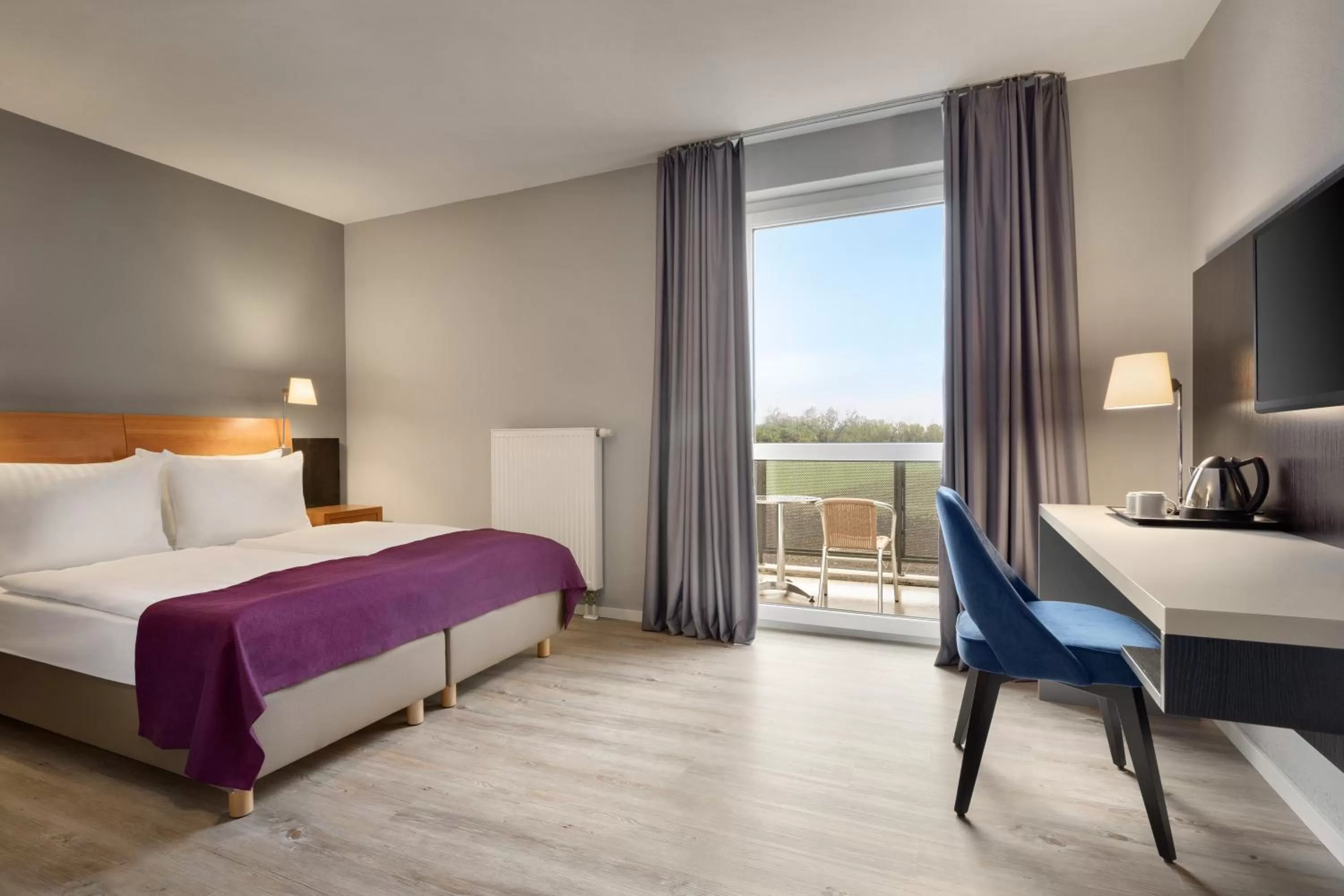 Photo of the whole room, Bed in Ramada by Wyndham München Airport