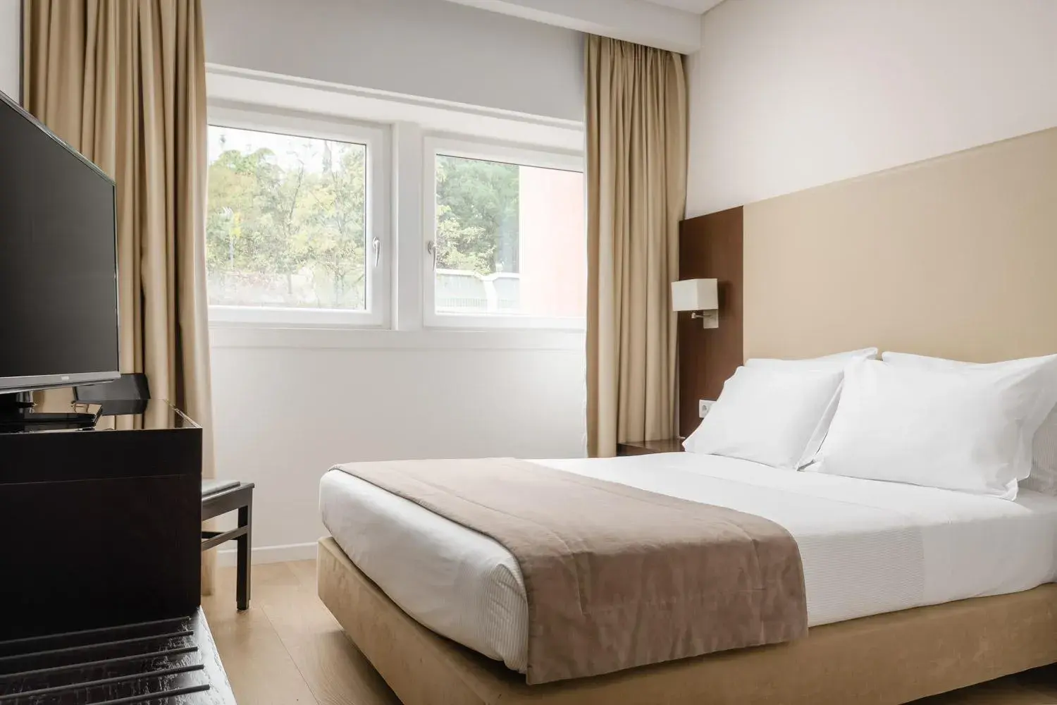 Bed in Lisboa Central Park Hotel Suites & Studios
