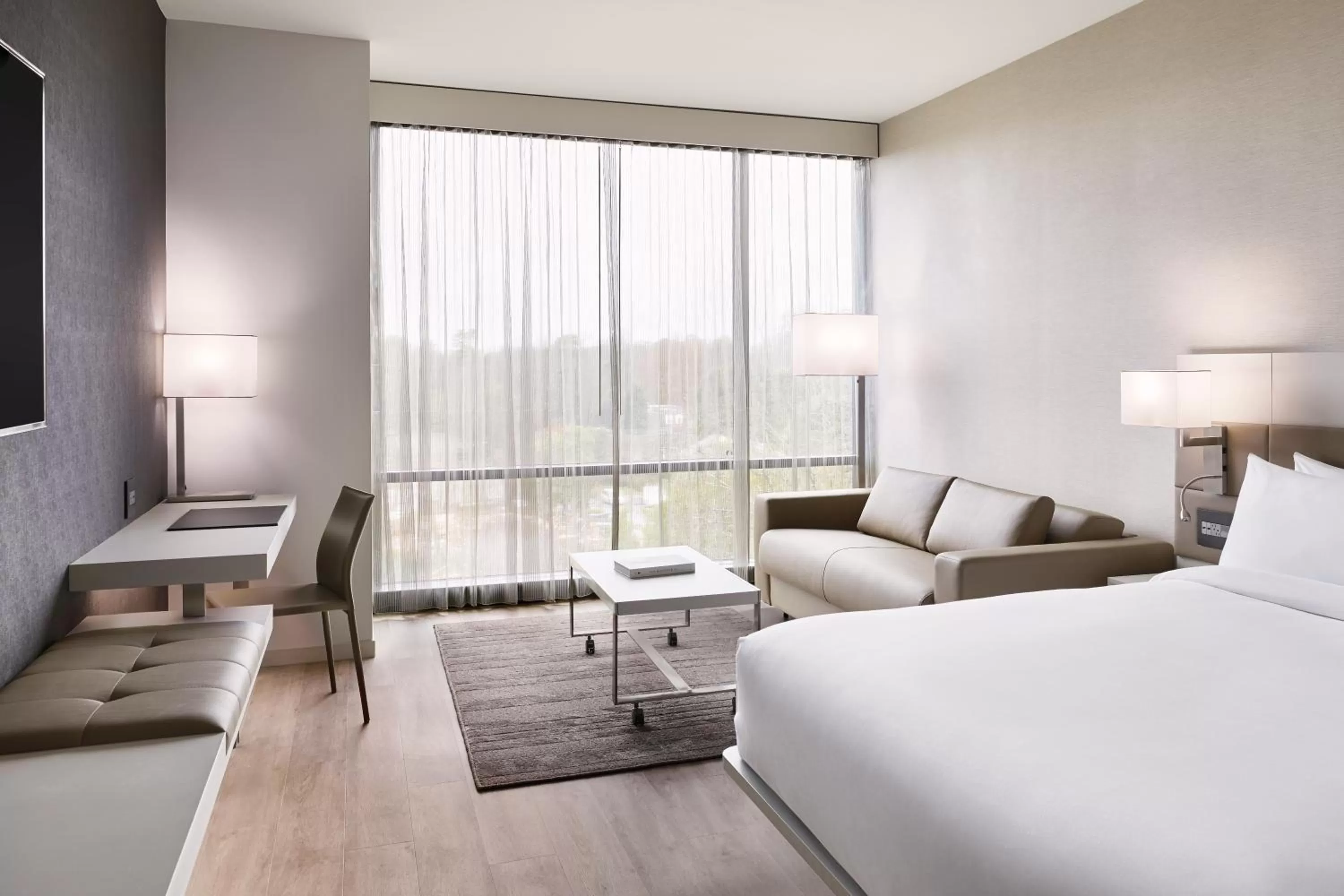 King Room with Sofa Bed - Hearing Accessible in AC Hotel by Marriott Charlotte SouthPark