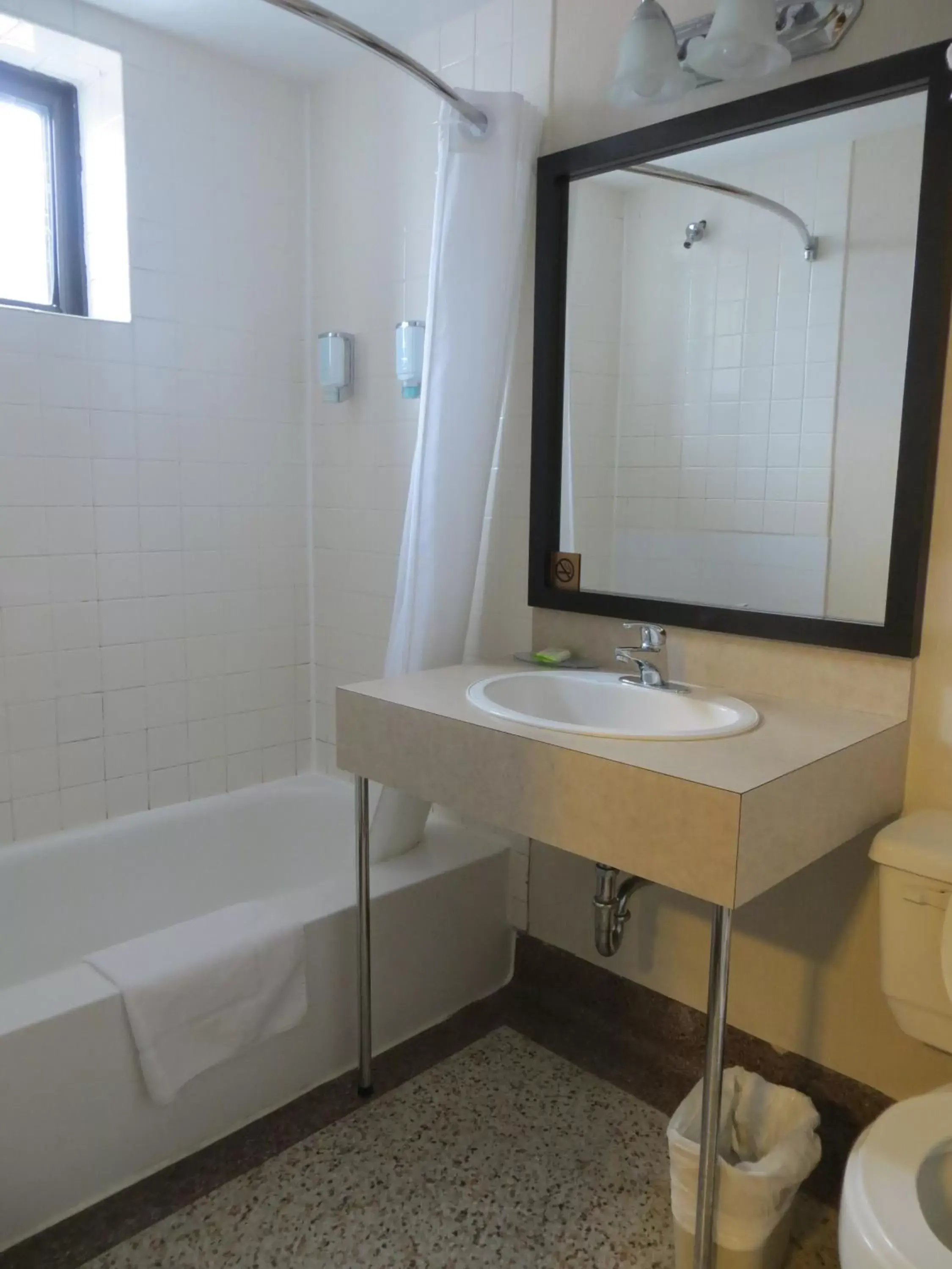 Bathroom in Travelodge by Wyndham Thunder Bay ON