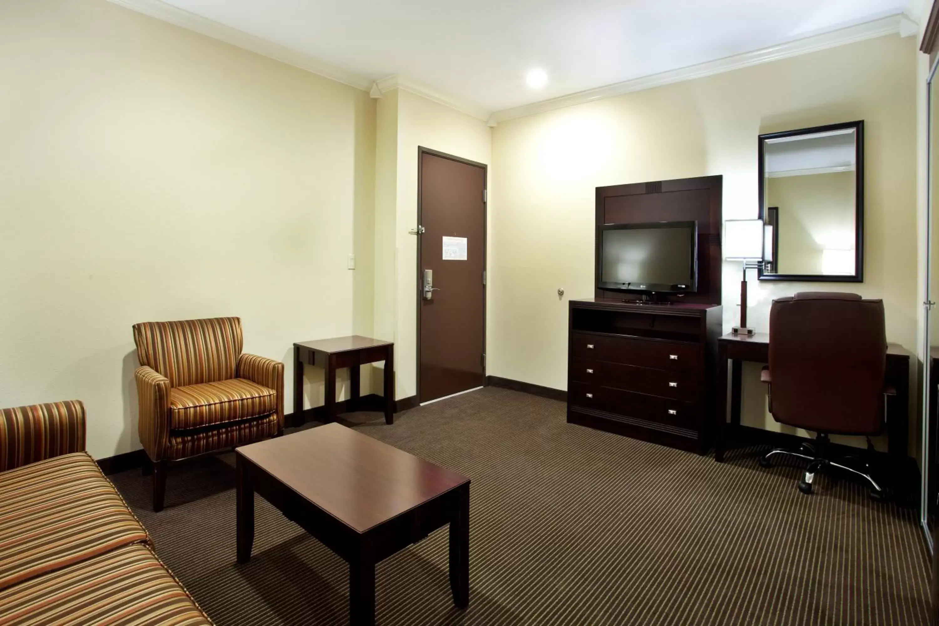 Photo of the whole room, TV/Entertainment Center in Holiday Inn Hotel & Suites Lake Charles South, an IHG Hotel