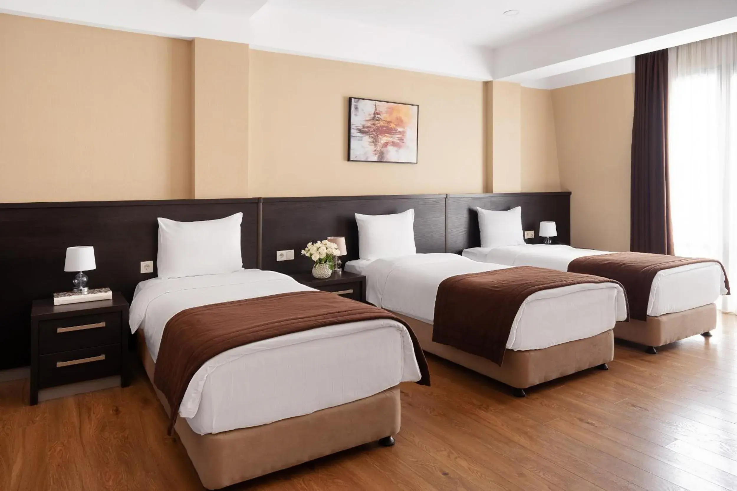 Bed in Sephia Hotel