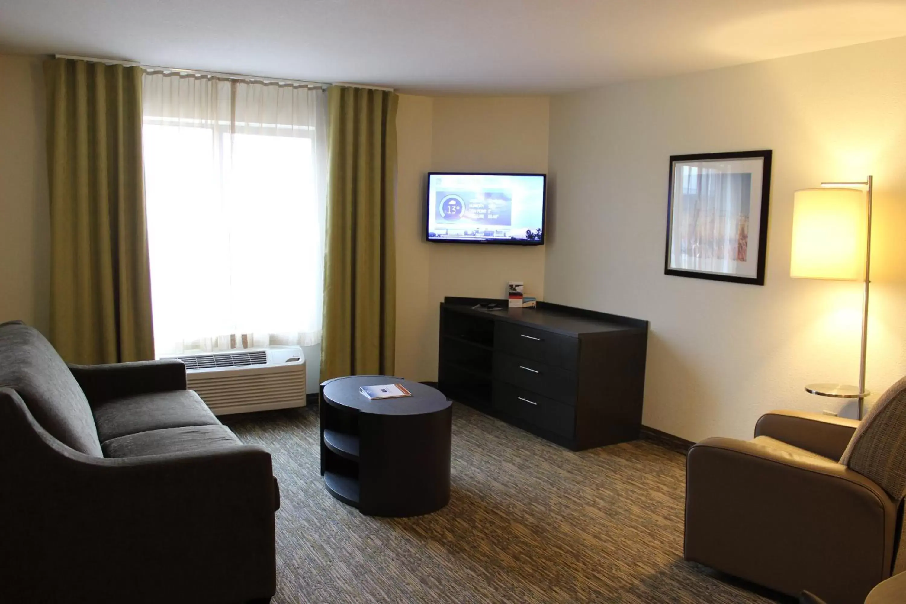 Photo of the whole room, TV/Entertainment Center in Candlewood Suites Manhattan, an IHG Hotel