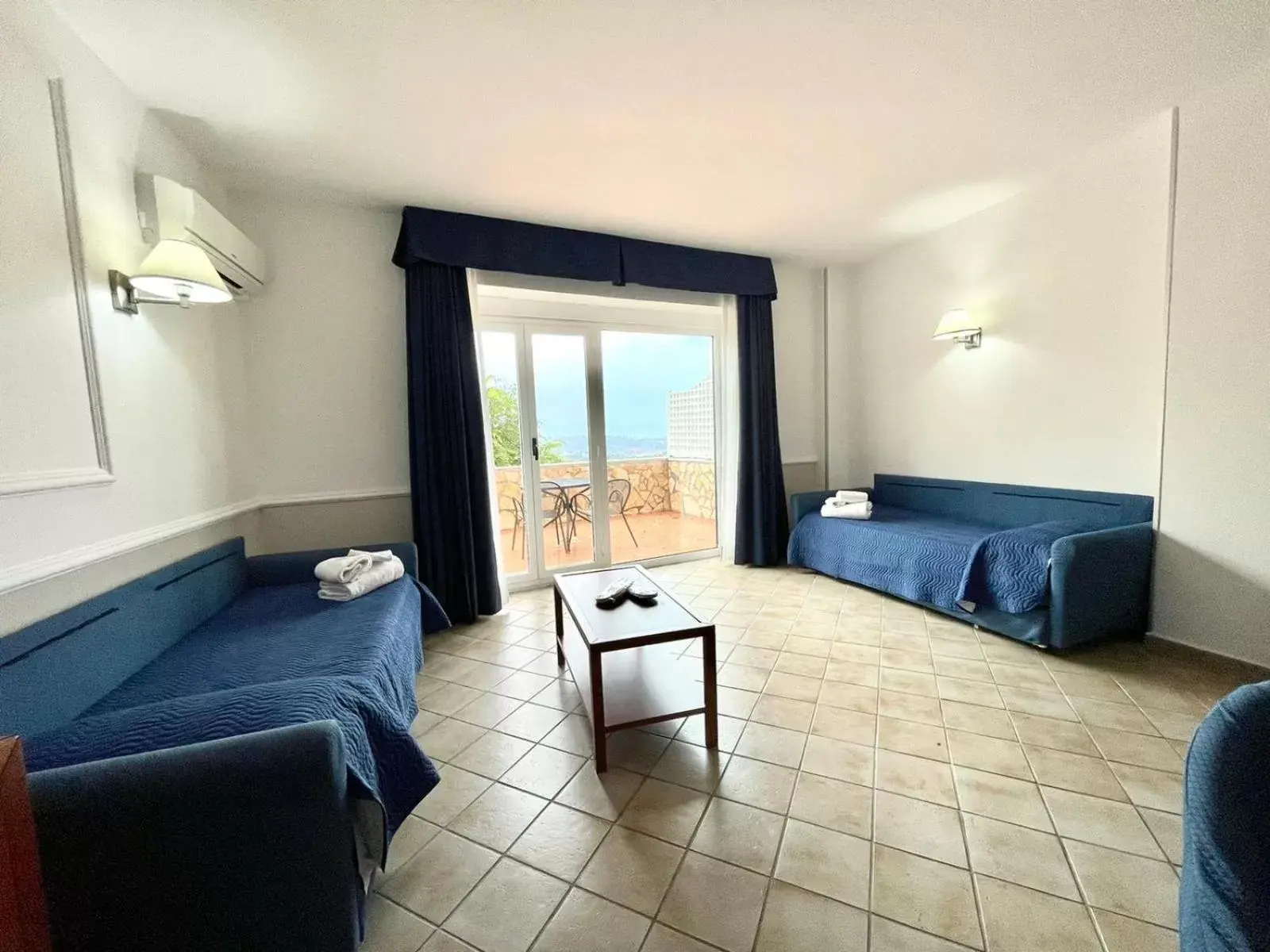 Family Room with Balcony in Gli Dei Family Room with Balcony in Gli Dei