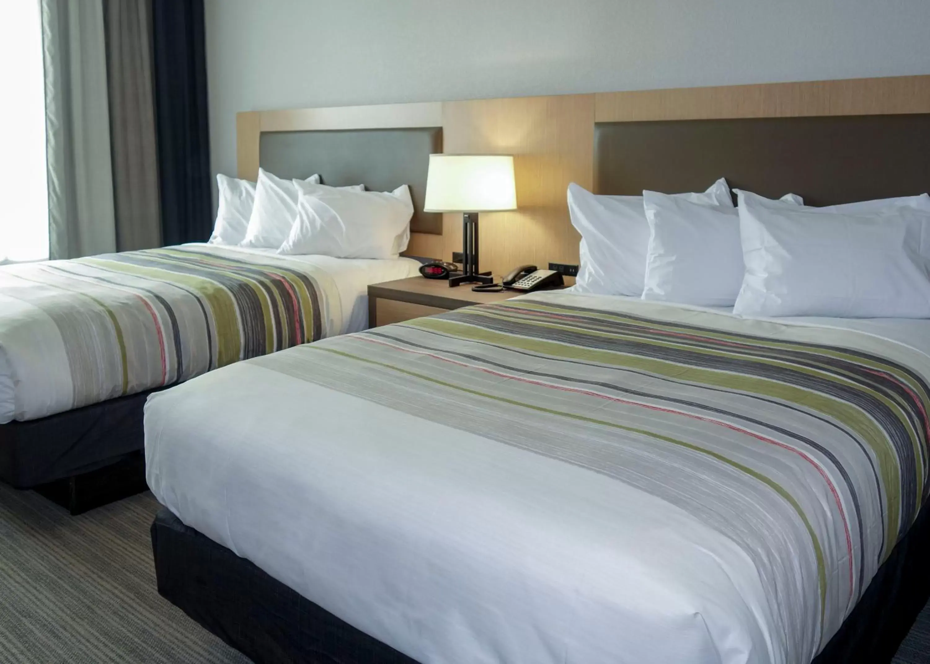 Bed in Country Inn & Suites by Radisson, New Braunfels, TX