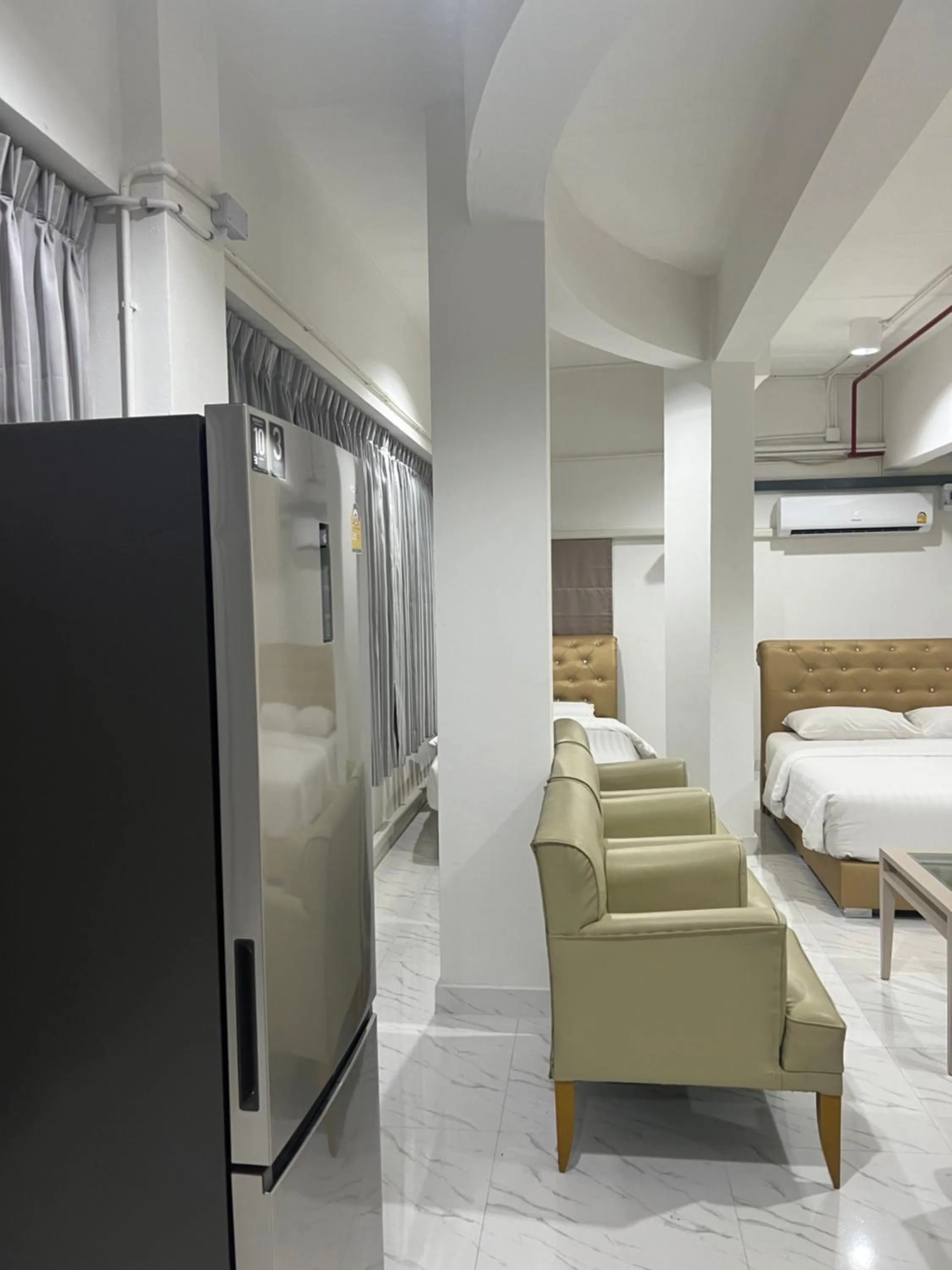 Bed in Mall Suites Hotel