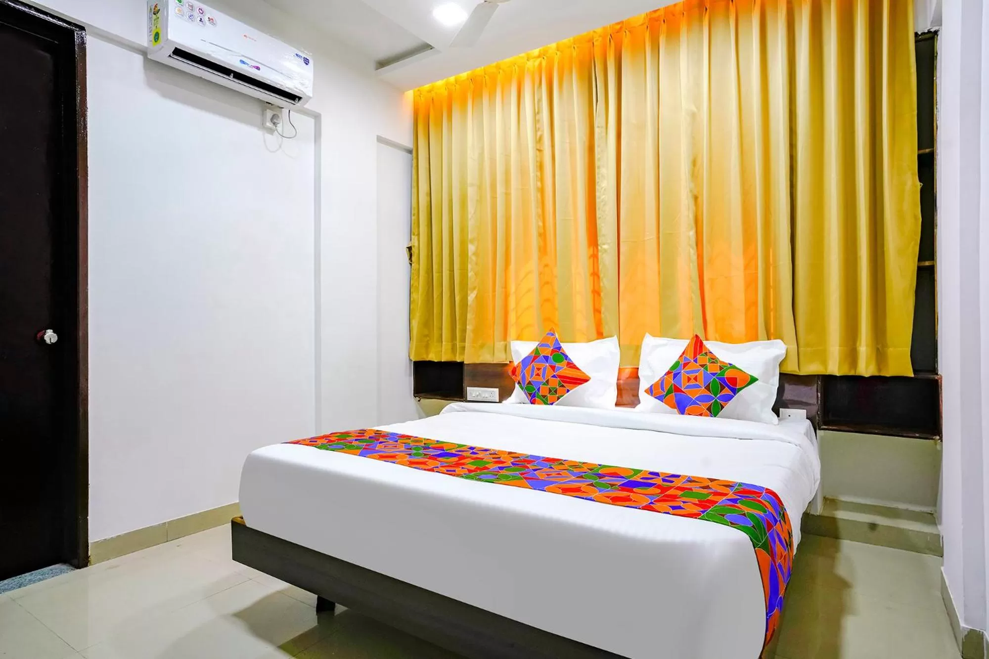 Bed in FabHotel Woods Regency