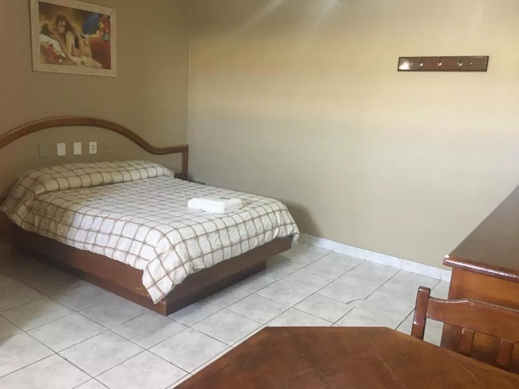 Bed in Hotel Solar Flores