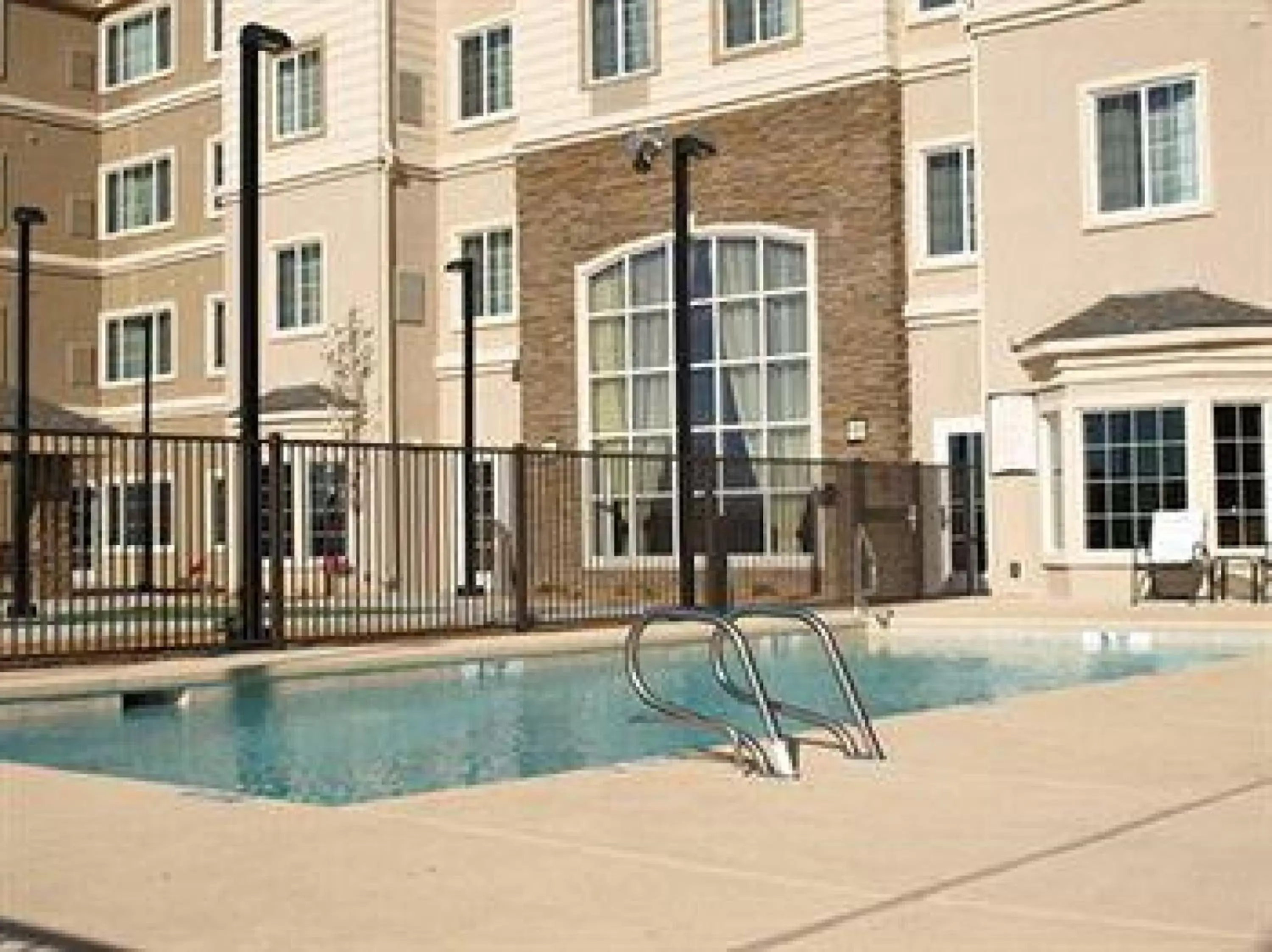 Swimming pool, Property Building in Staybridge Suites - Albuquerque Airport, an IHG Hotel