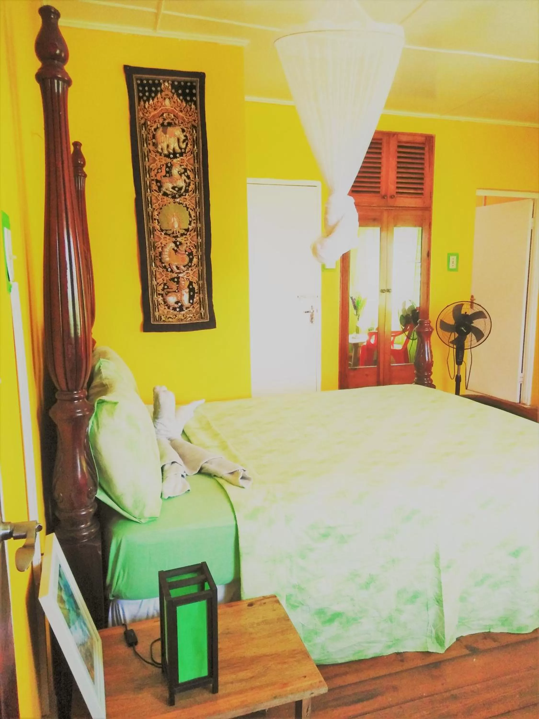 Bed in TOGA GUEST HOUSE