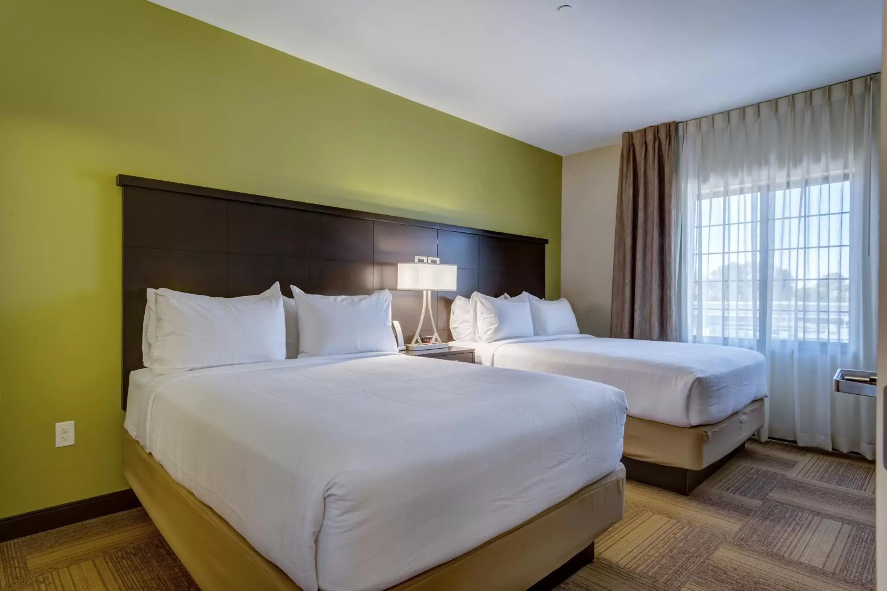 Bedroom, Bed in Staybridge Suites St Louis - Westport, an IHG hotel