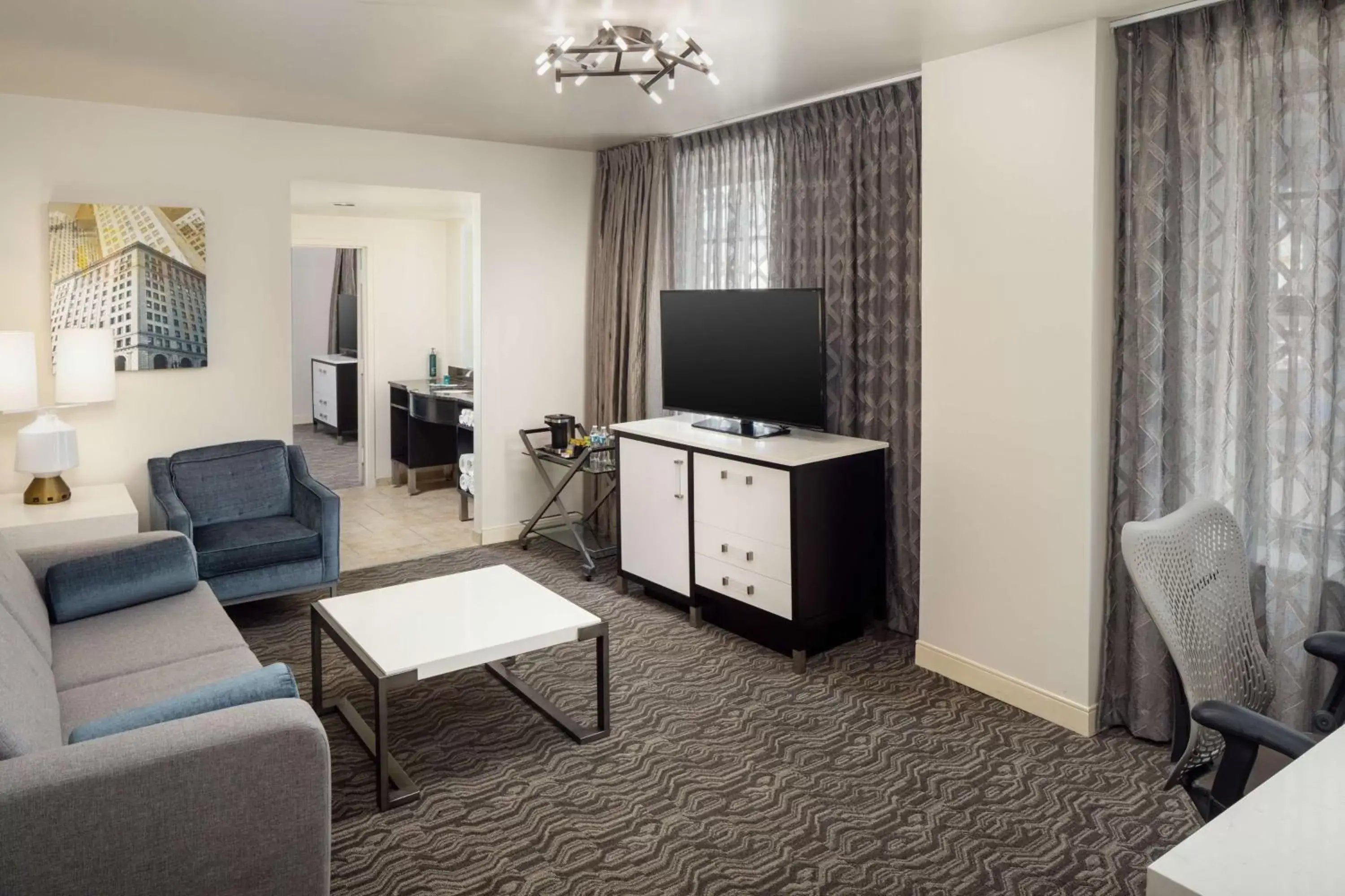 Living room, TV/Entertainment Center in DoubleTree Suites by Hilton Hotel Detroit Downtown - Fort Shelby