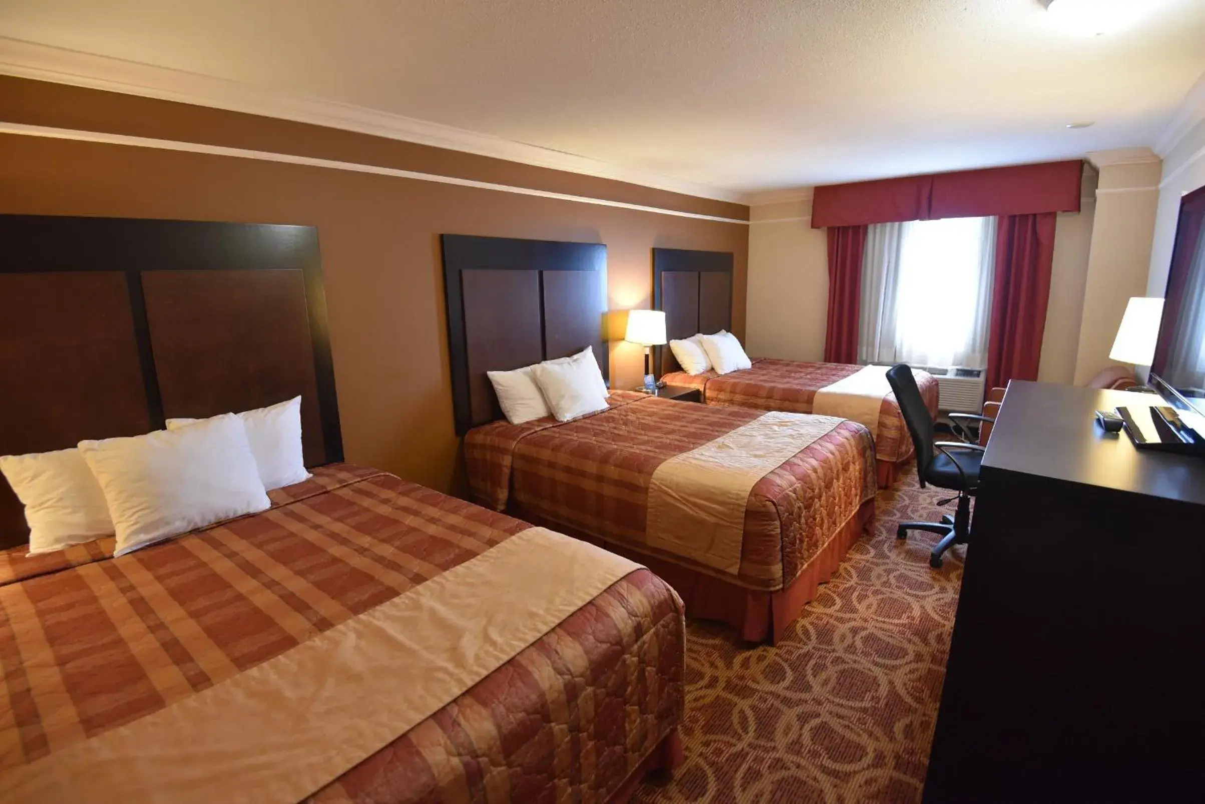 Superior Queen Room with Three Queen Beds - Non-Smoking in Travelodge by Wyndham Meadow Lake