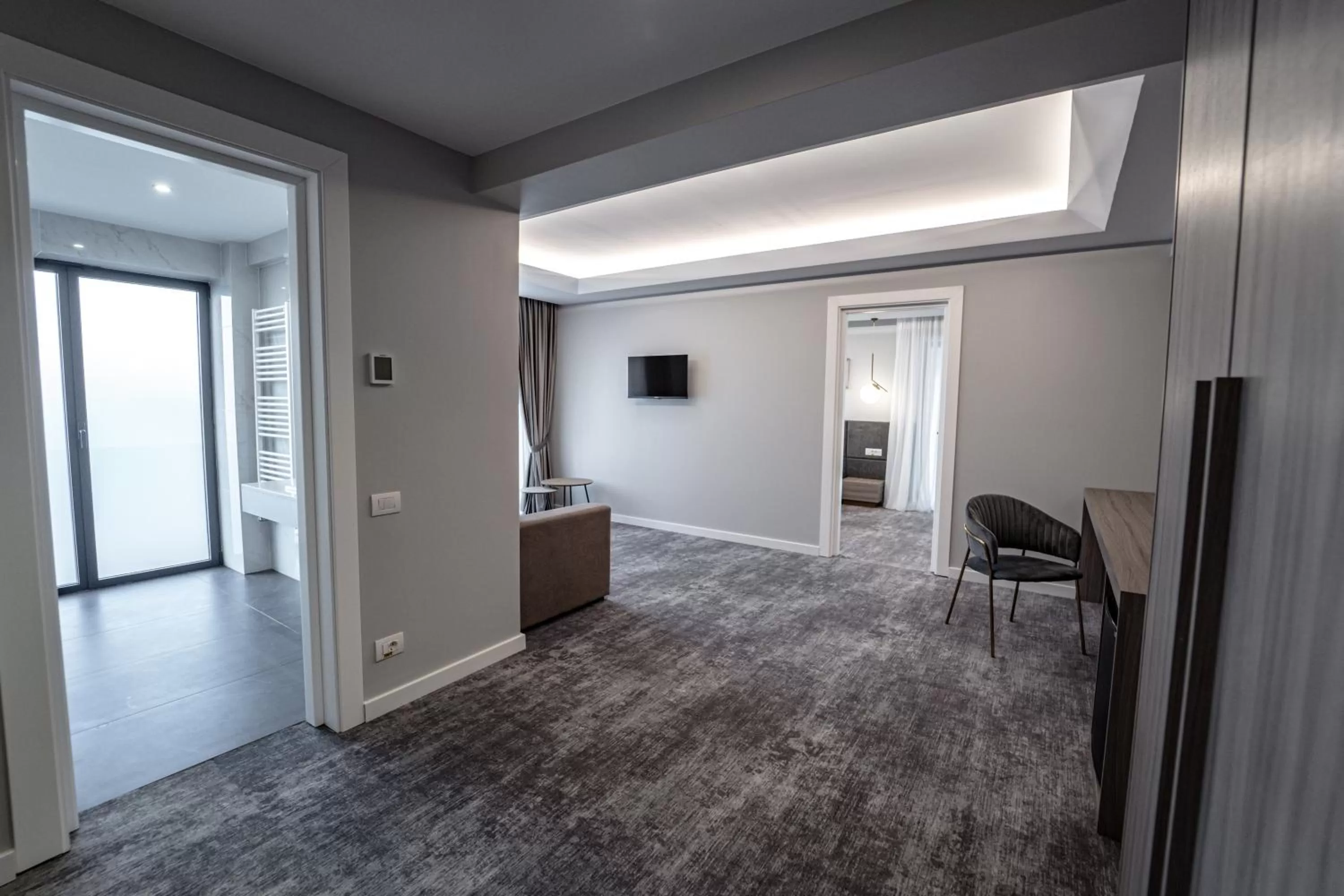 Living room, TV/Entertainment Center in Caprice Complex