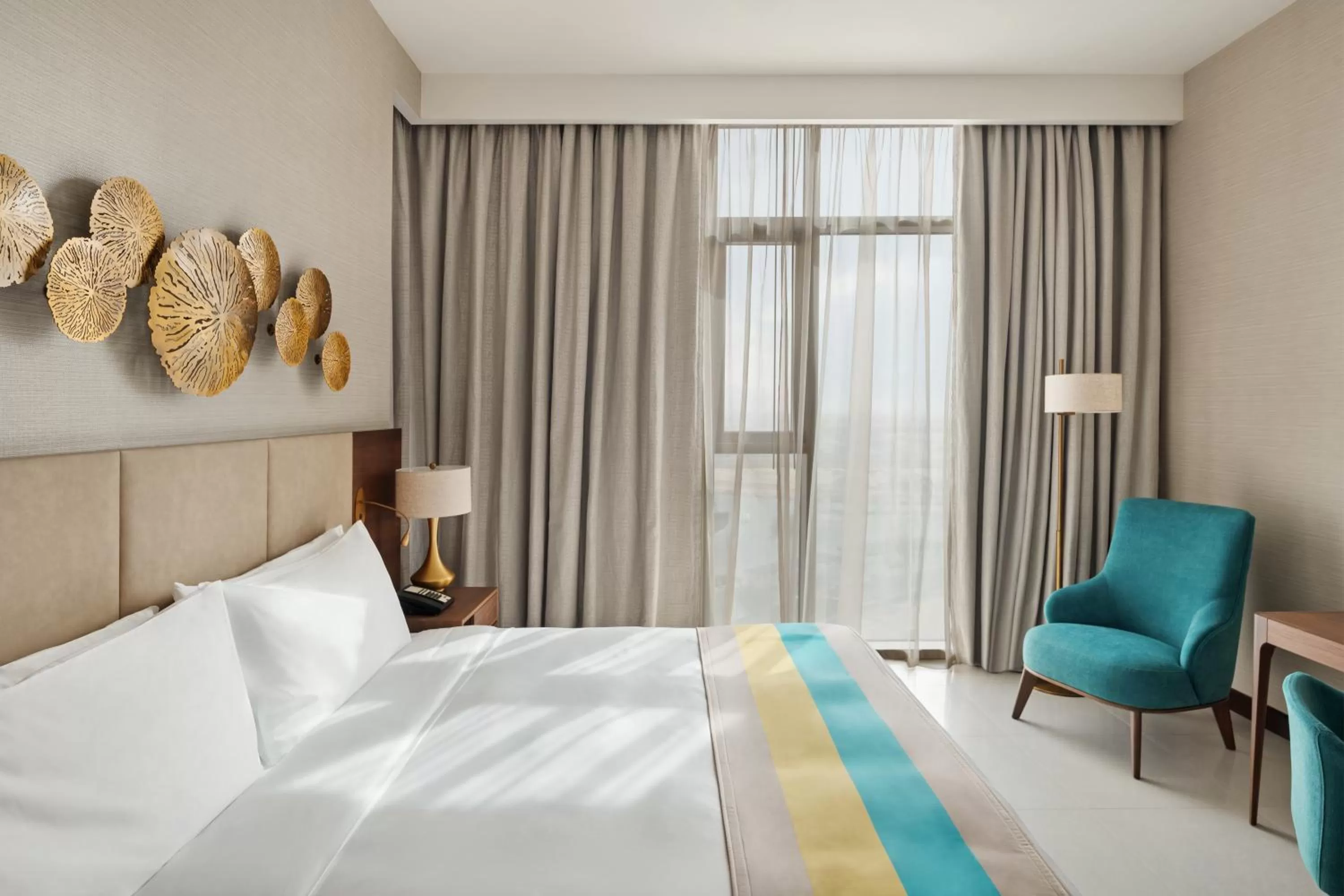 Bed in Holiday Inn Dubai Al-Maktoum Airport by IHG