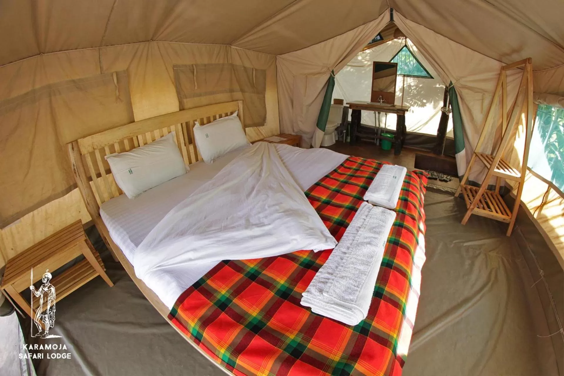 Bed in Kara-Tunga Safari Camp