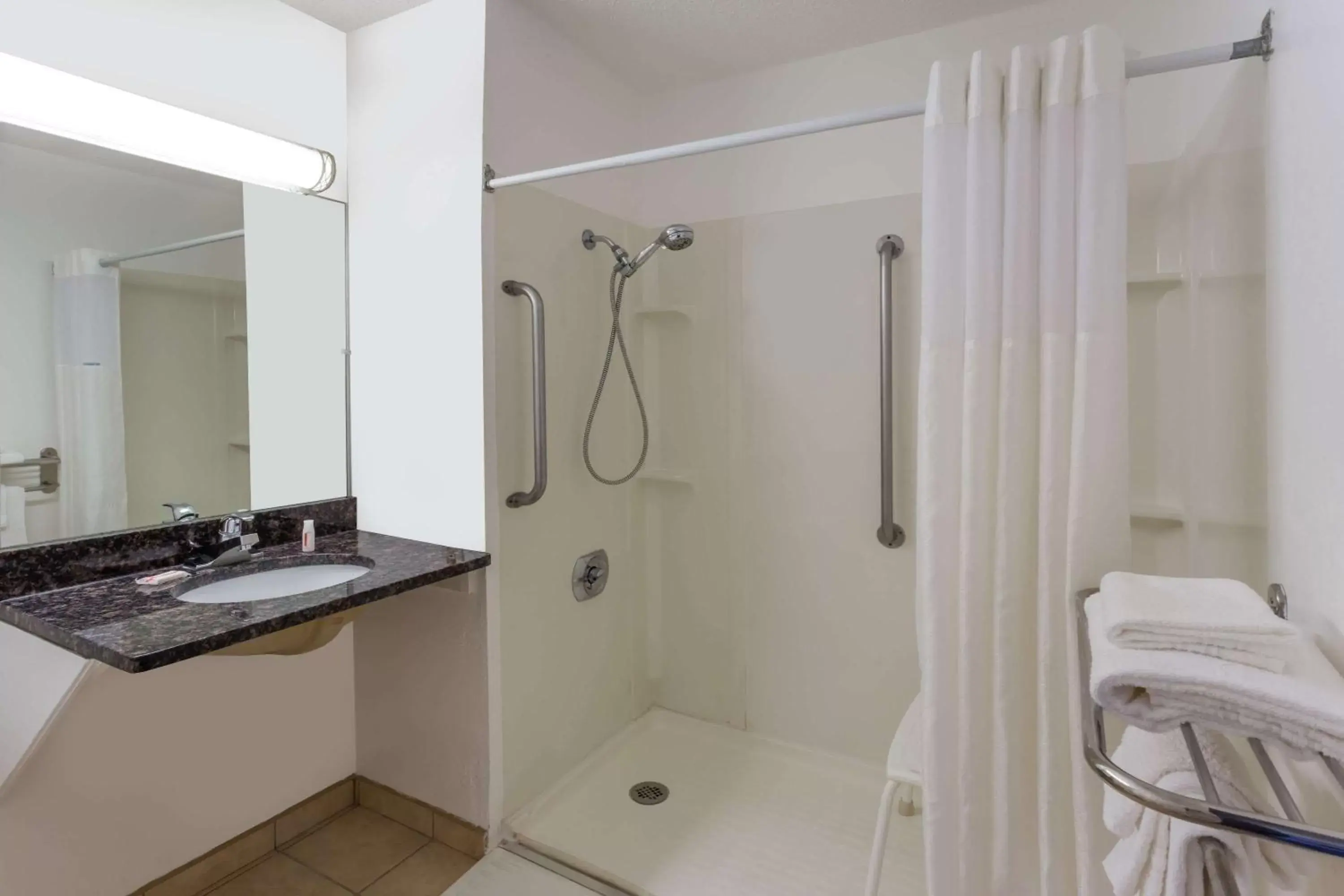 Shower, Bathroom in Super 8 by Wyndham Janesville