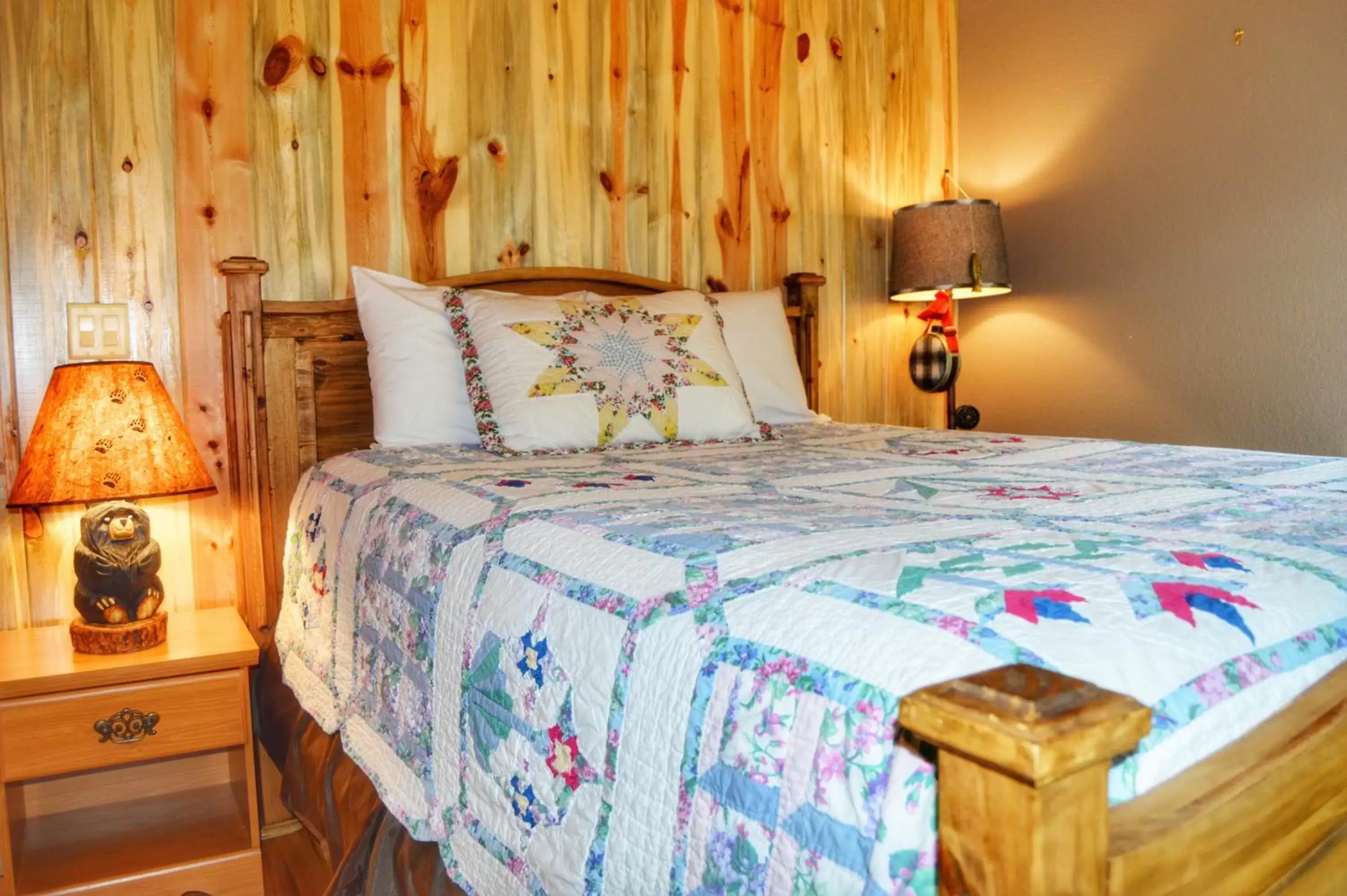 Bed in The Inn on Fall River & Fall River Cabins