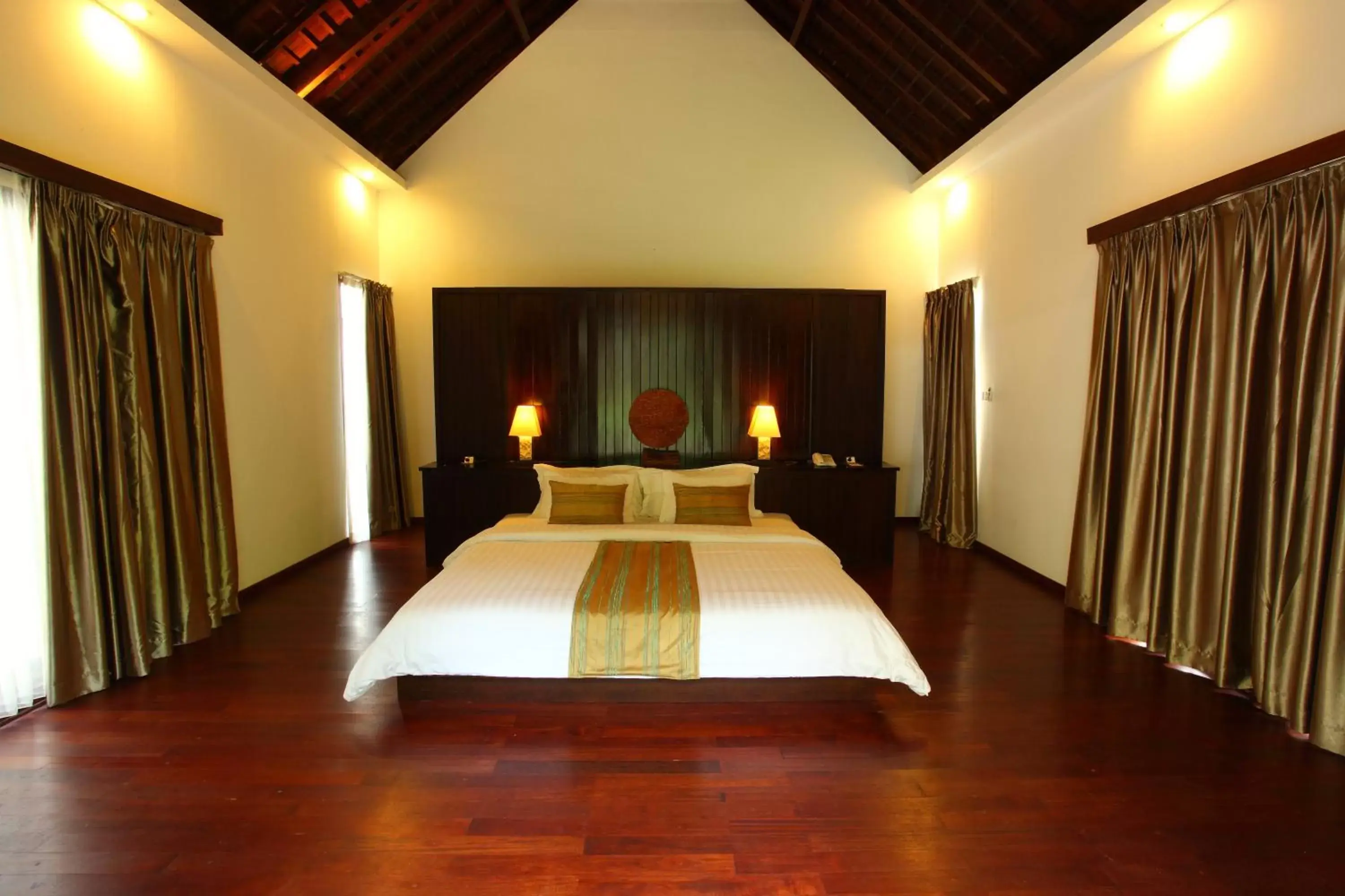 Bed in Kebun Villas & Resort