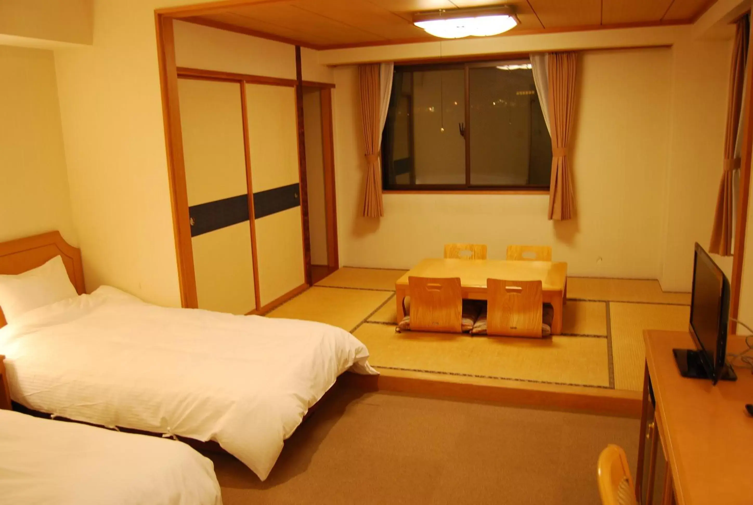 Bed in Hakuba Panorama Hotel