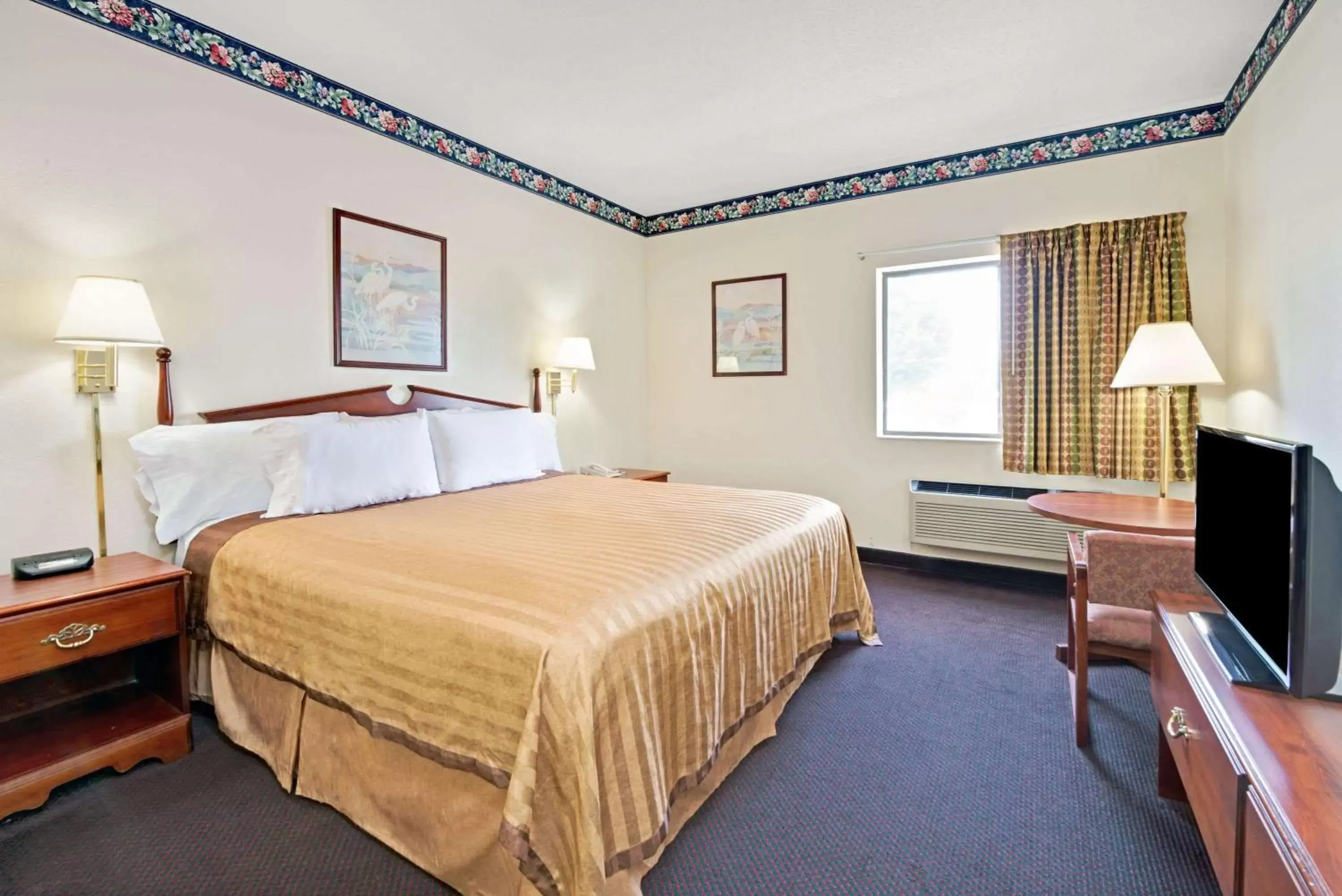 Bedroom, Bed in Travelodge by Wyndham St. Louis