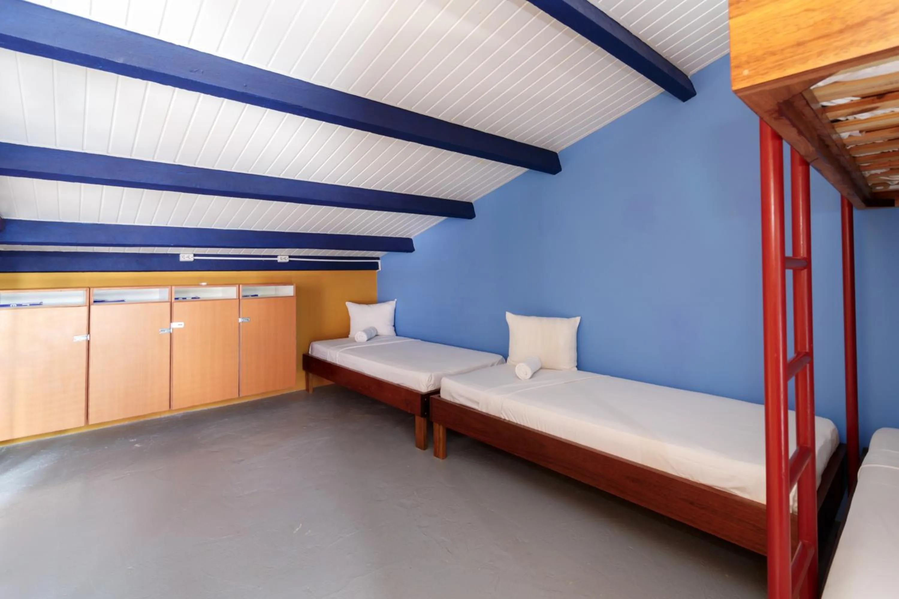 bunk bed, Seating Area in First Curacao Hostel