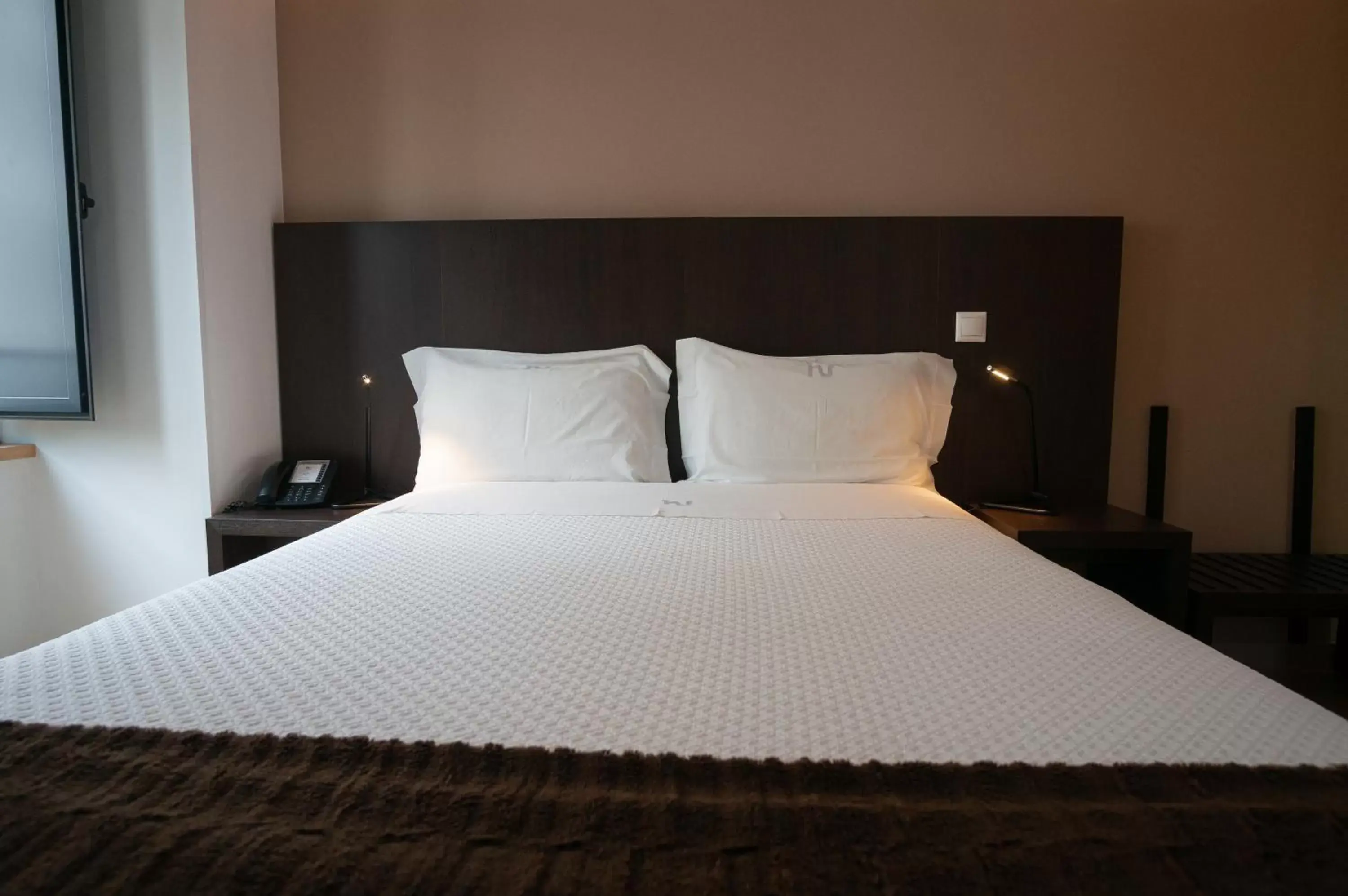 Bed in Hotel Vitória