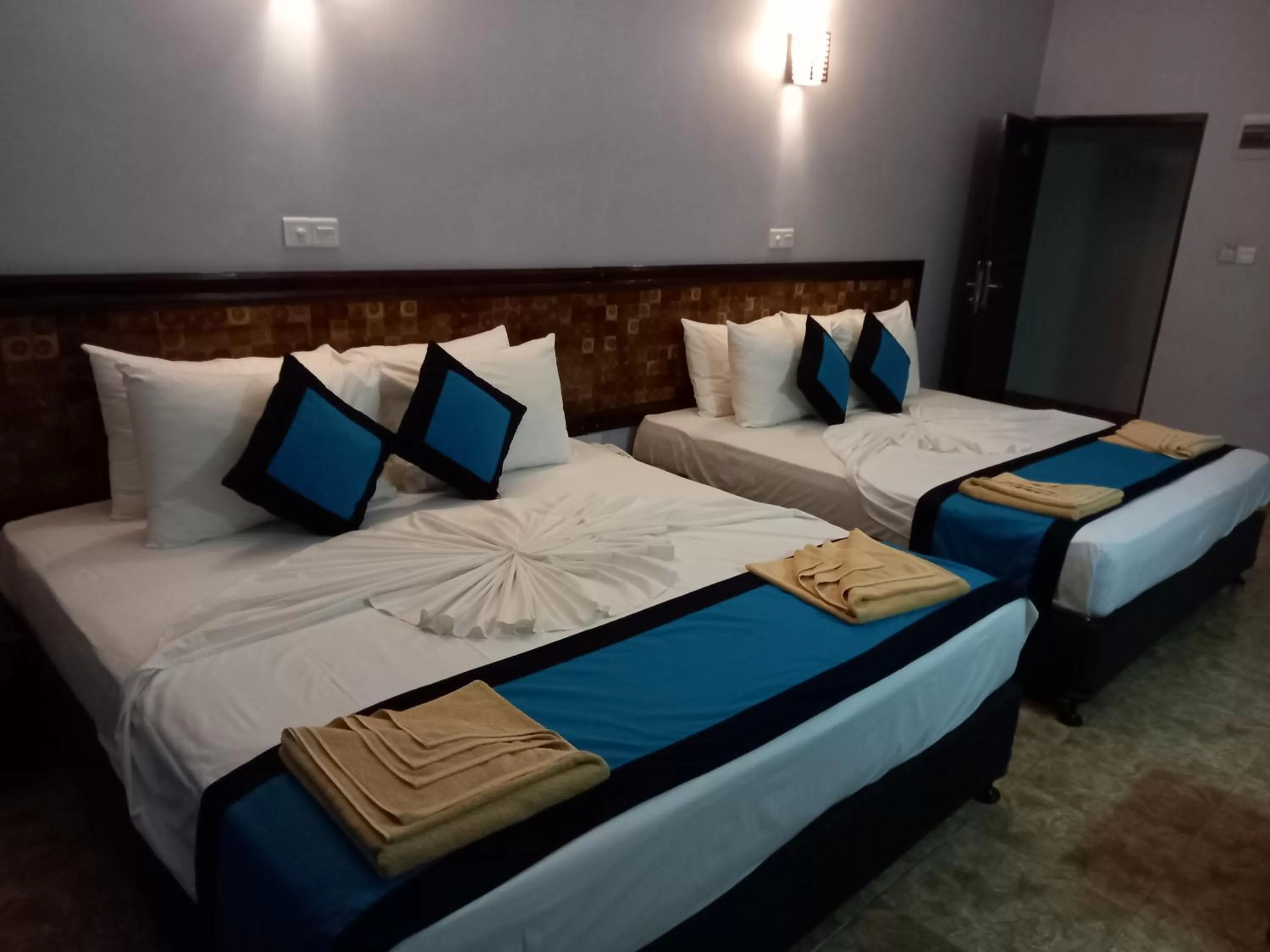 Bed in Blue Sand Beach Resort