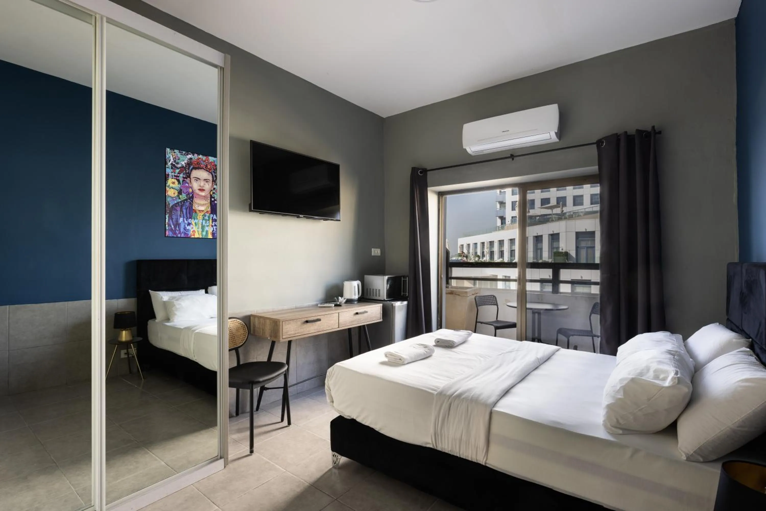 Photo of the whole room, Bed in Liber Tel Aviv Sea Shore Suites BY RAPHAEL HOTELS