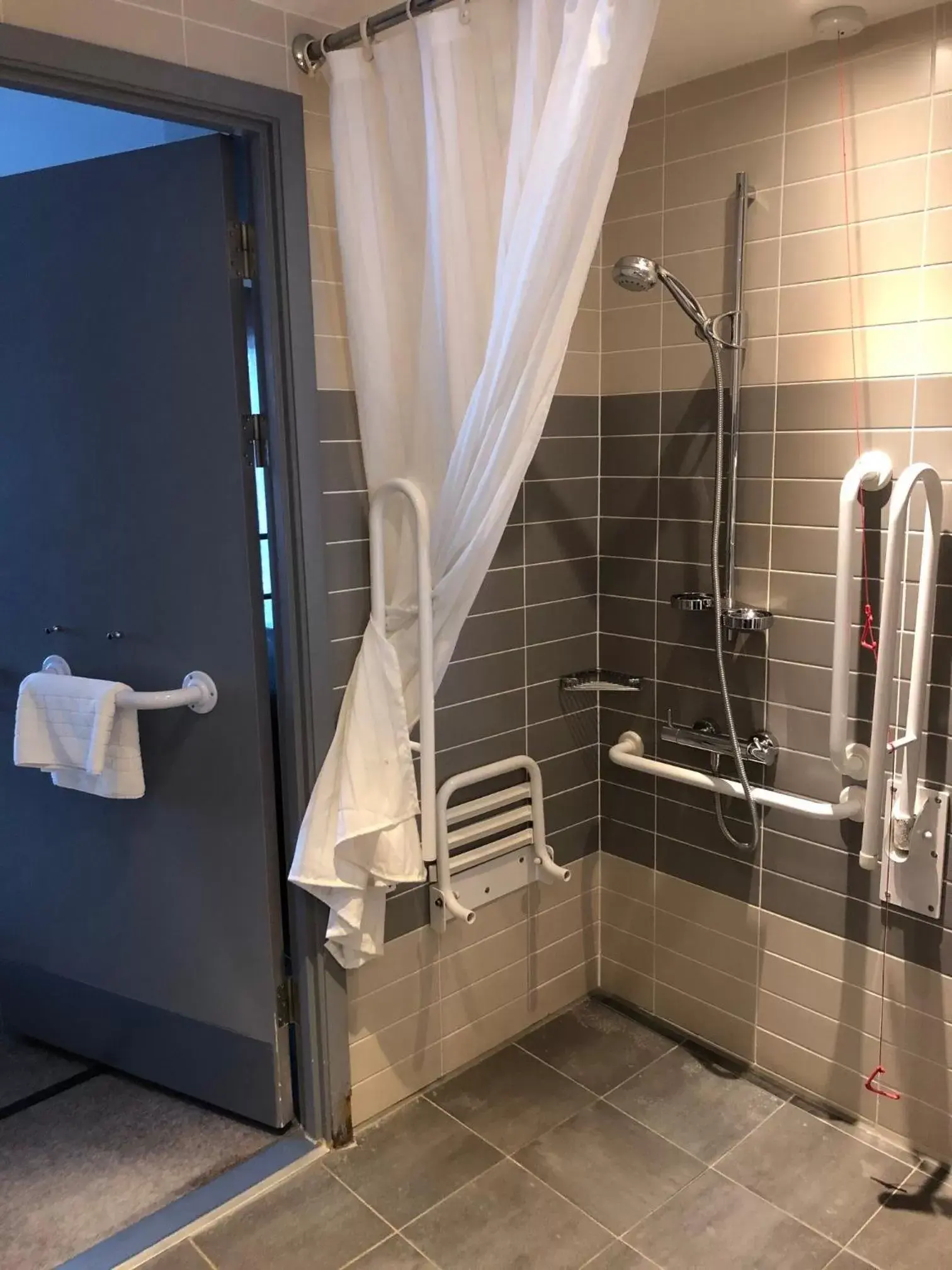 Facility for disabled guests, Bathroom in Crowne Plaza Manchester City Centre, an IHG Hotel