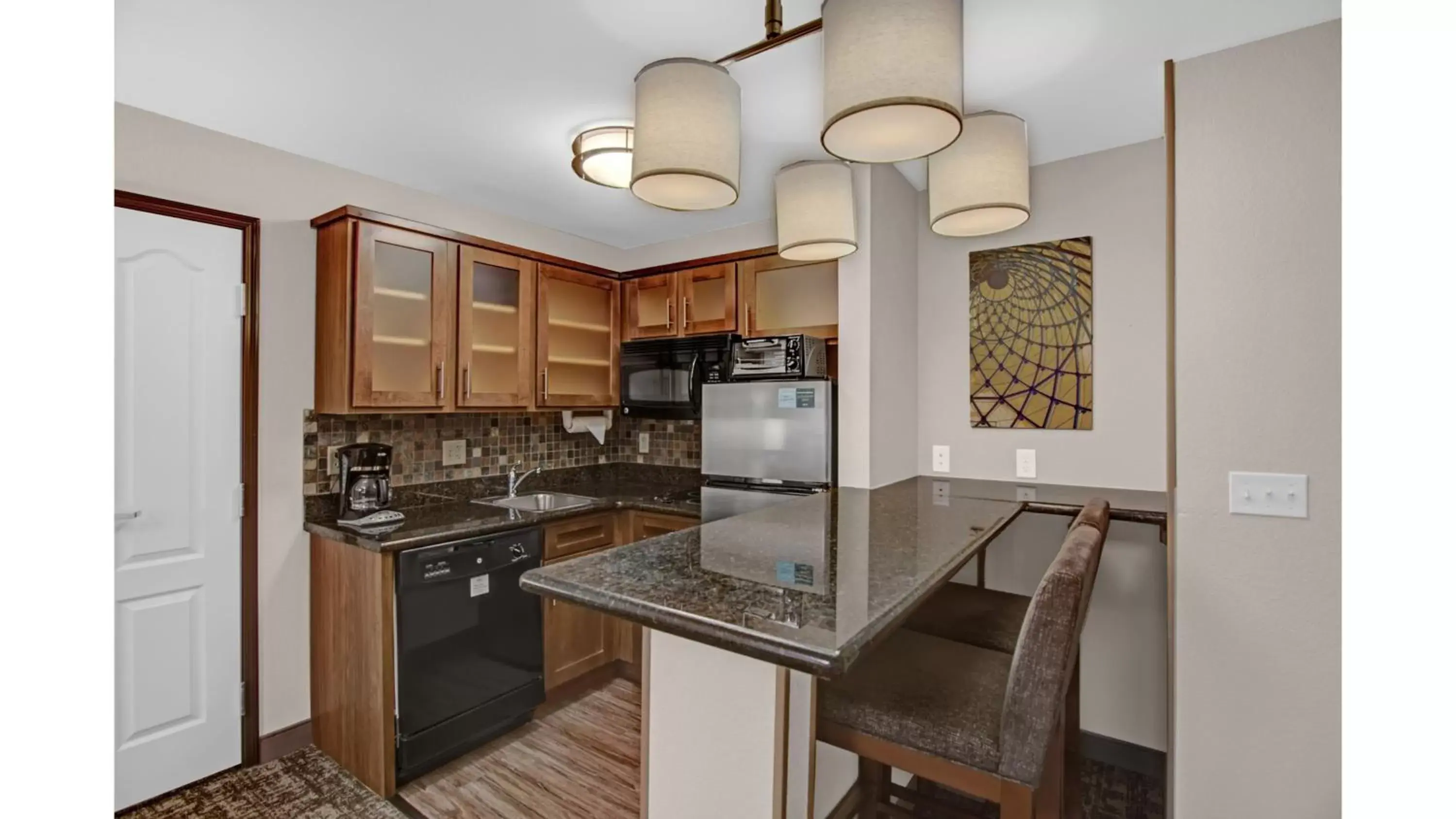 Photo of the whole room, Kitchen/Kitchenette in Staybridge Suites Salt Lake-West Valley City, an IHG Hotel