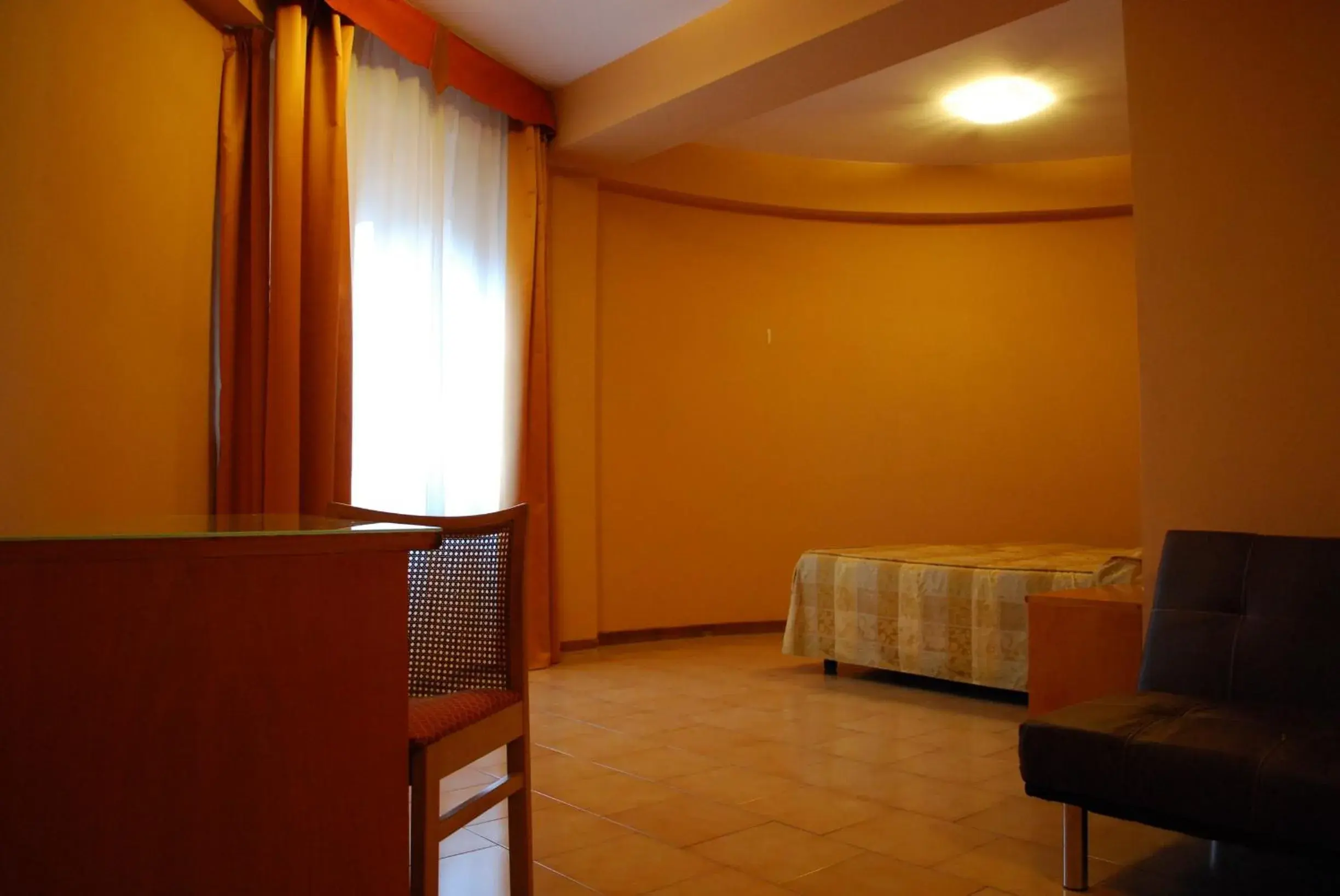 Bed, Seating Area in Hotel Tre Torri