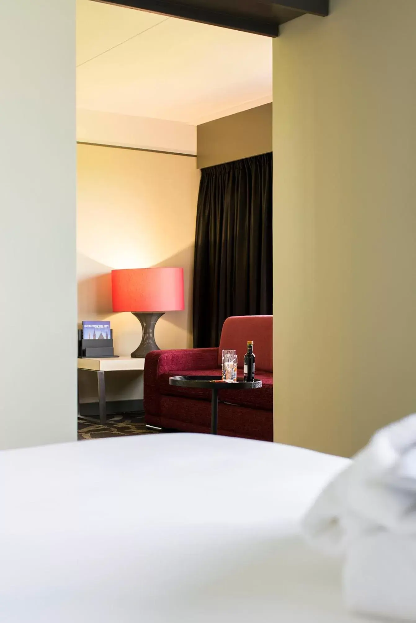 Seating area, Bed in Babylon Hotel Den Haag