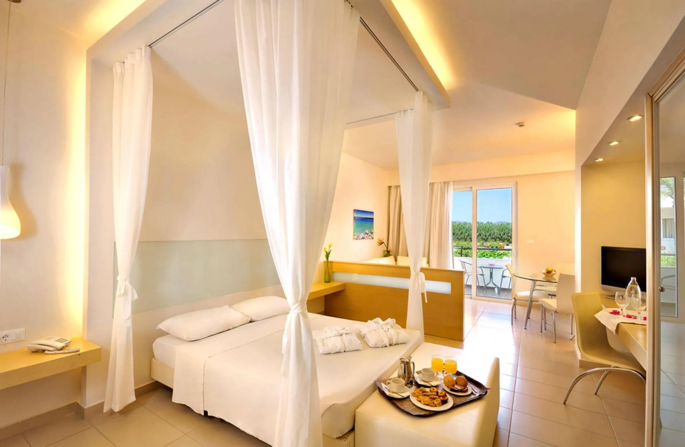 Bed in Afandou Bay Resort Suites