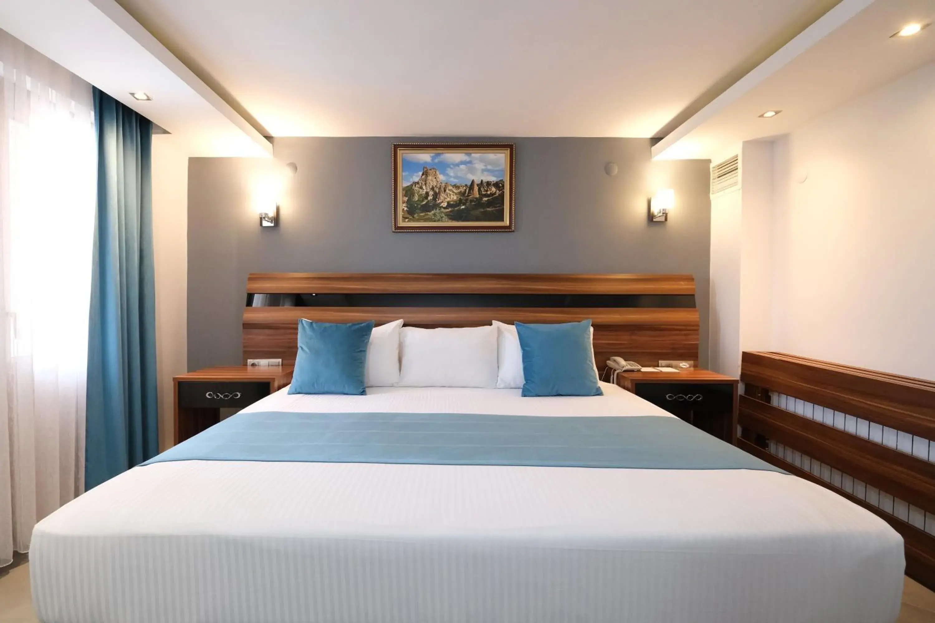 Bed in SIGNATURE GARDEN AVANOS Hotel & SPA